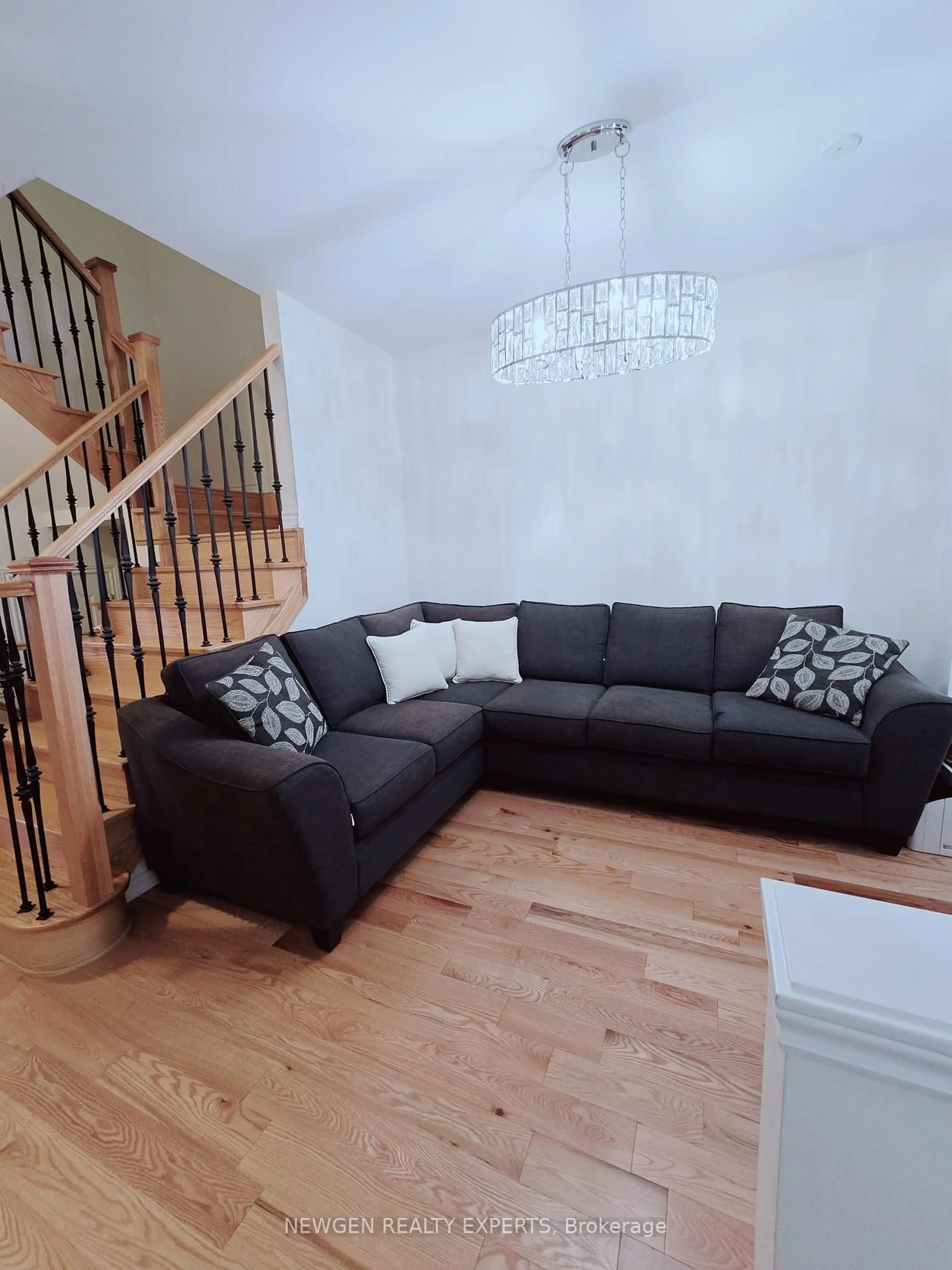 Living room with furniture, wood/laminate floor for 12 cachia Lane, Ajax Ontario L1T 0P8