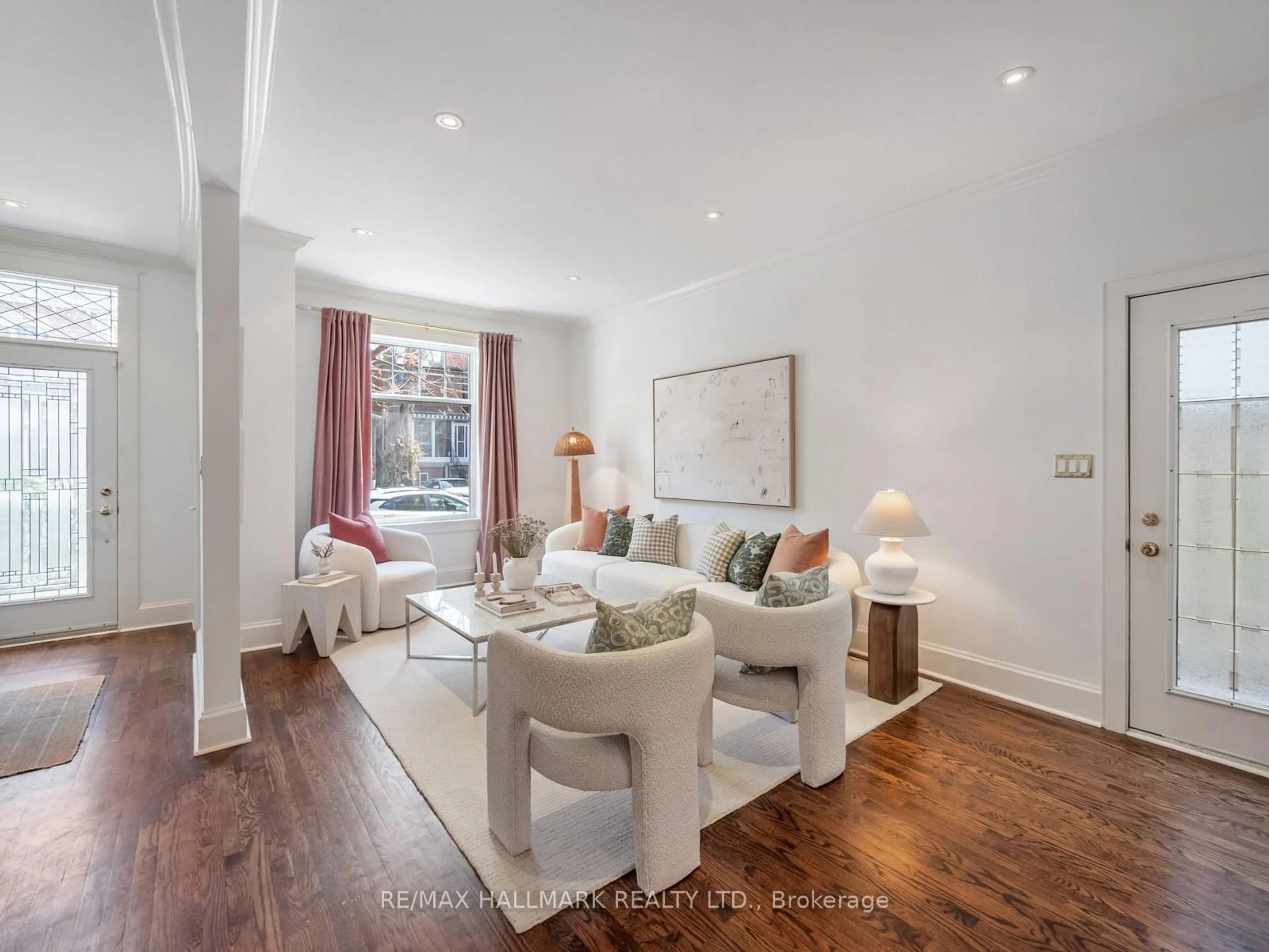 Living room with furniture, wood/laminate floor for 24 Boulton Ave, Toronto Ontario M4M 2J3