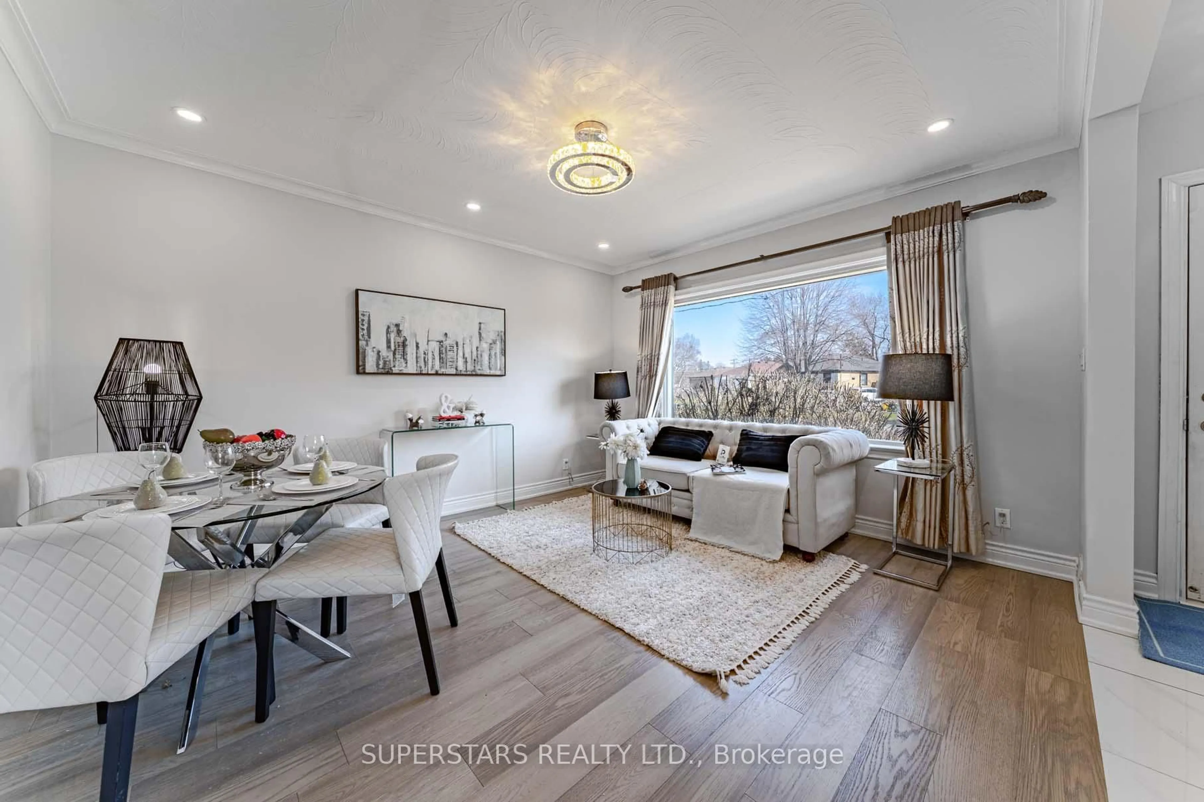 Living room with furniture, wood/laminate floor for 106 Ainsdale Rd, Toronto Ontario M1R 3Z2