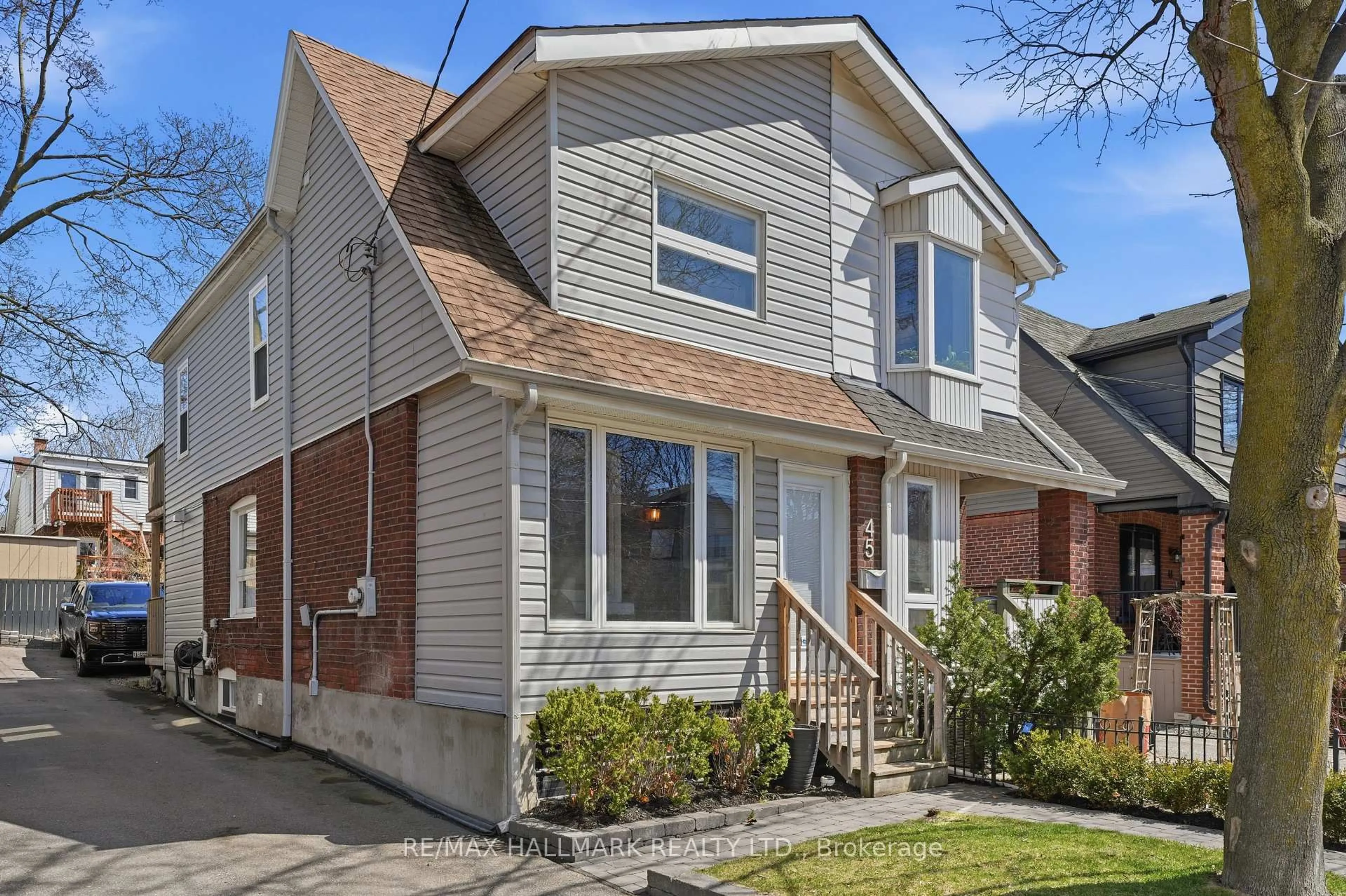 Home with vinyl exterior material, street for 45 Hiltz Ave, Toronto Ontario M4L 2N6