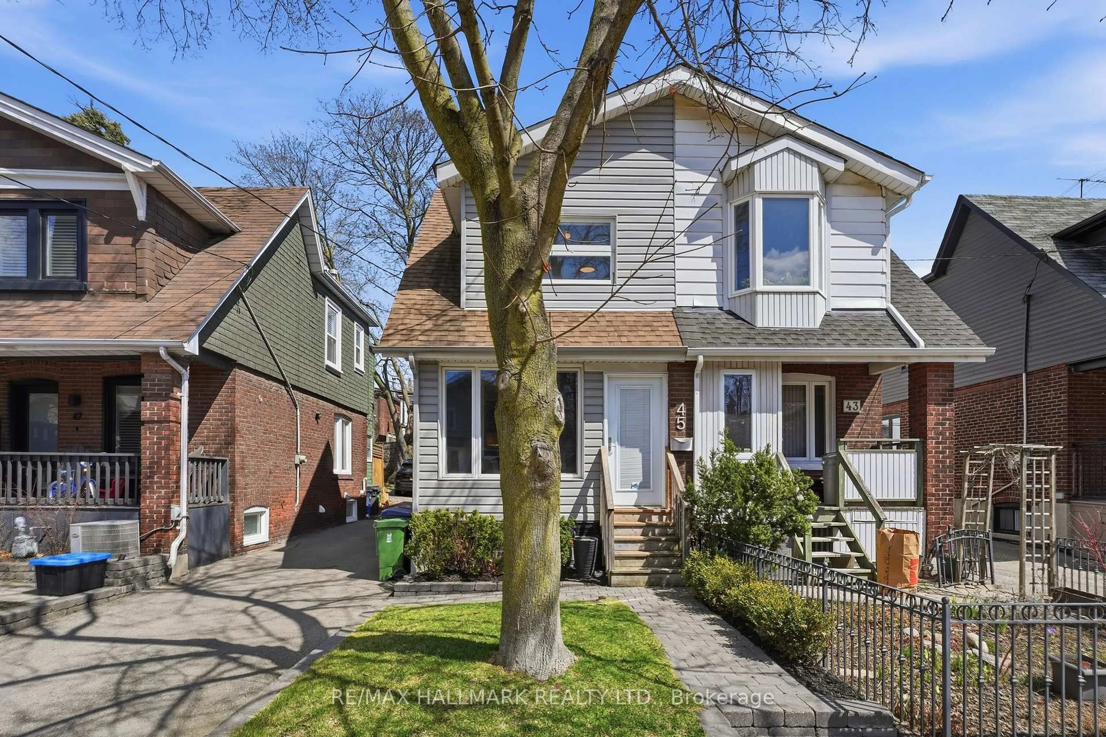 Home with brick exterior material, street for 45 Hiltz Ave, Toronto Ontario M4L 2N6