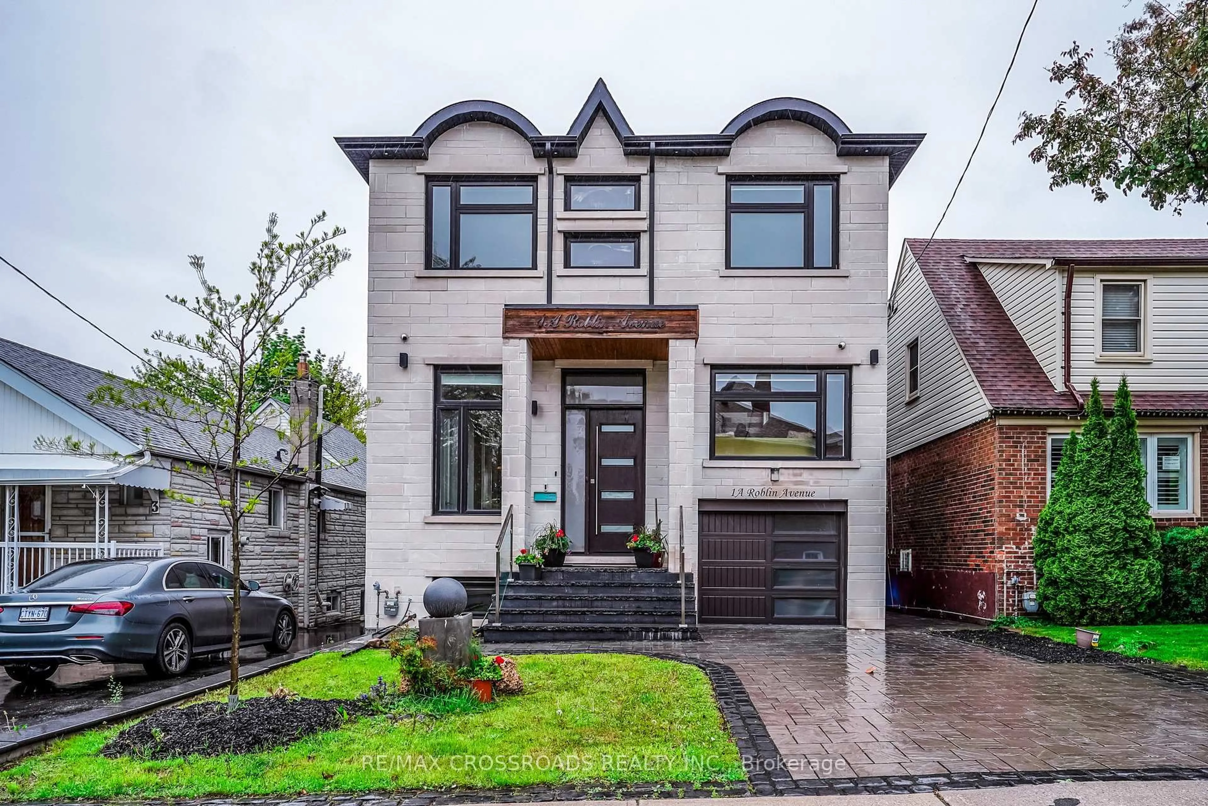 Home with brick exterior material, street for 1A Roblin Ave, Toronto Ontario M4C 3P7
