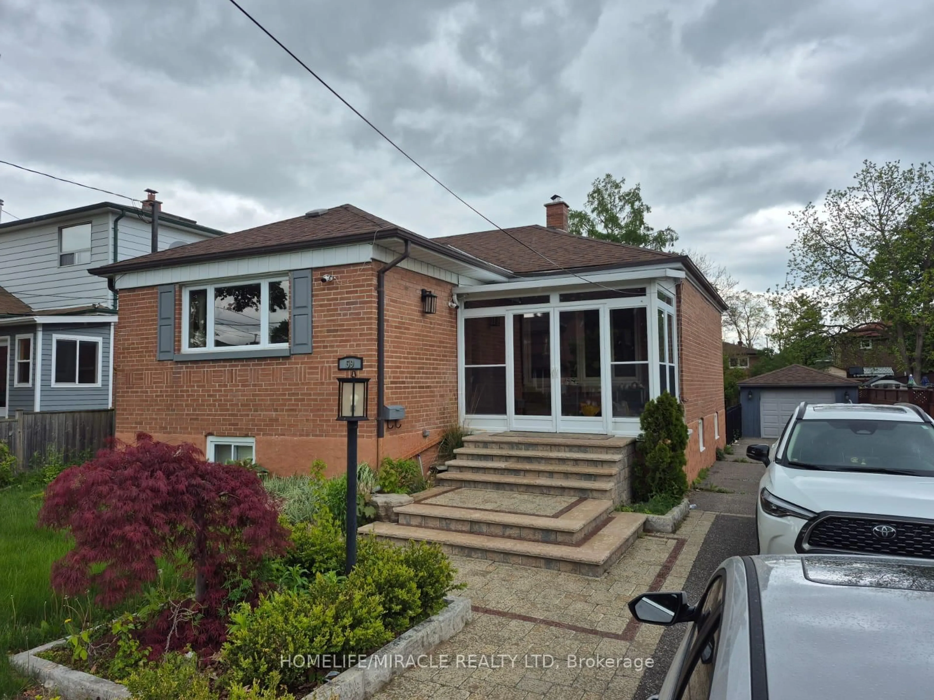 A pic from outside/outdoor area/front of a property/back of a property/a pic from drone, street for 59 Falaise Rd, Toronto Ontario M1E 3B7