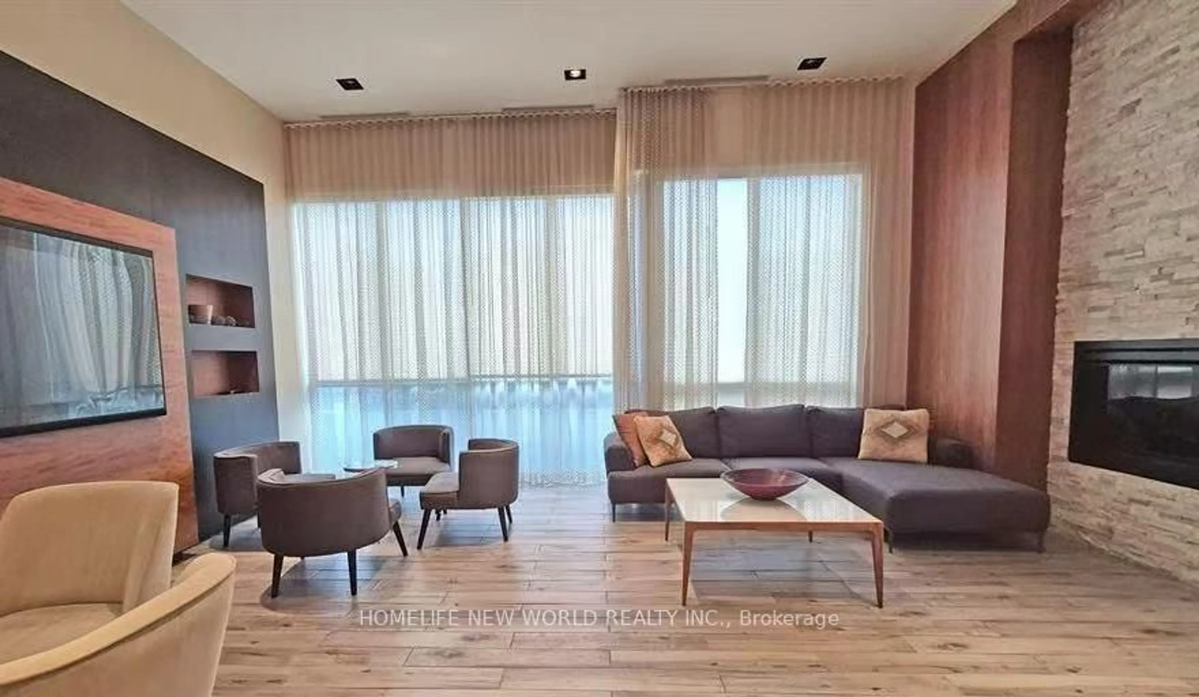 Living room with furniture, wood/laminate floor for 50 Town Centre Crt #1803, Toronto Ontario M1P 0A9