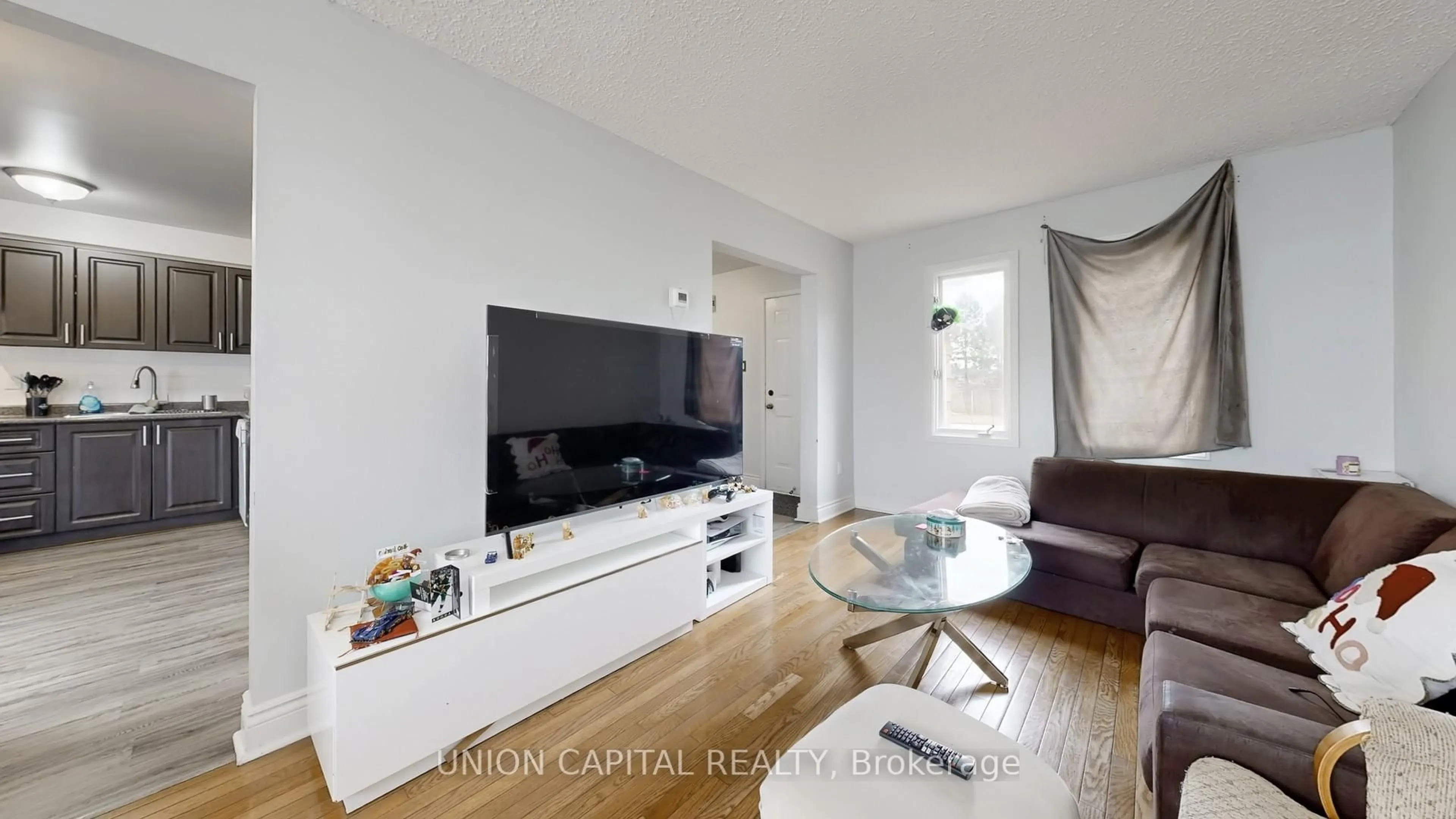 Living room with furniture, wood/laminate floor for 142 Wright Cres, Ajax Ontario L1S 6X6