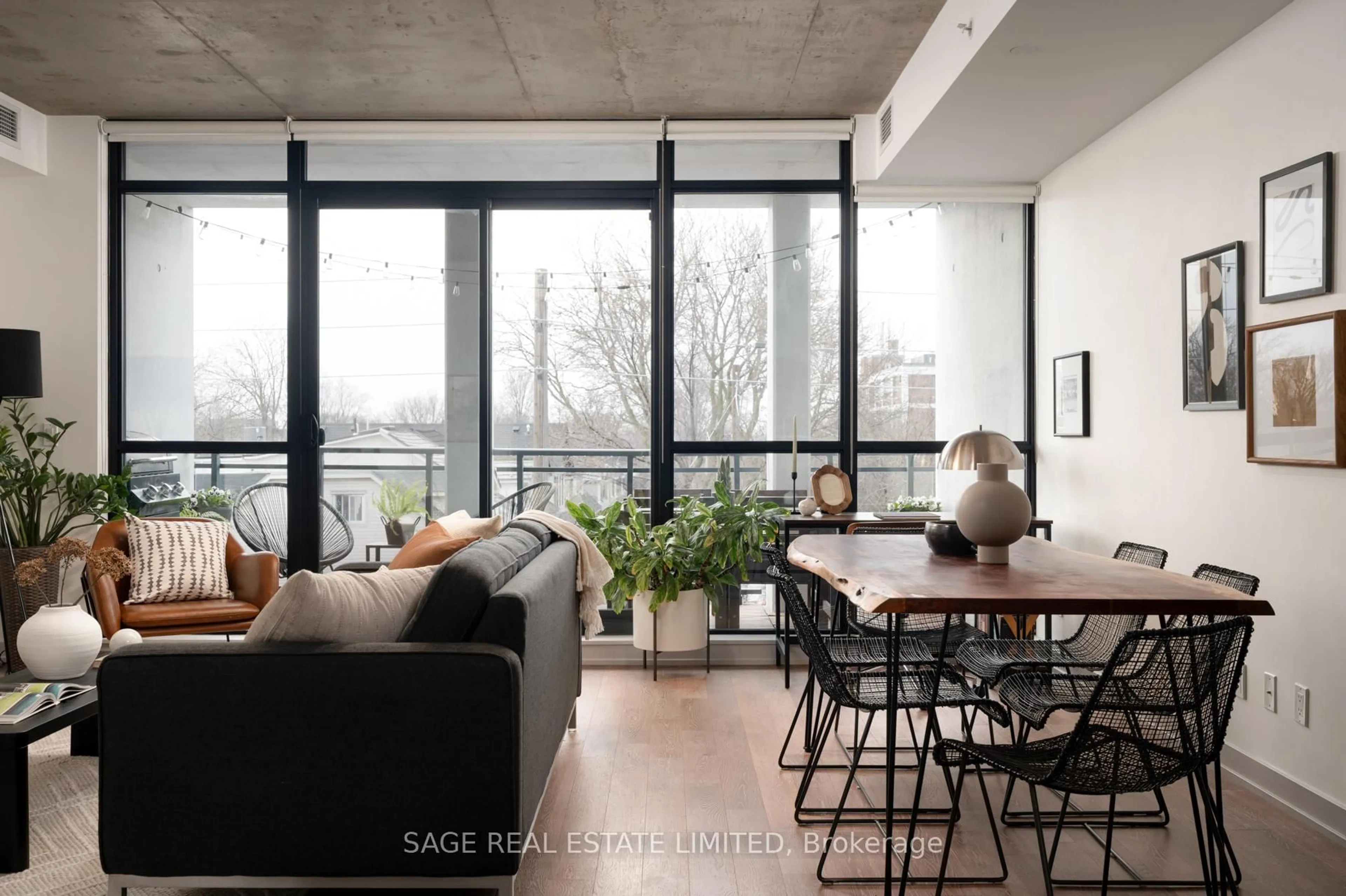Living room with furniture, cement floor for 1238 Dundas St #403, Toronto Ontario M4M 1S3