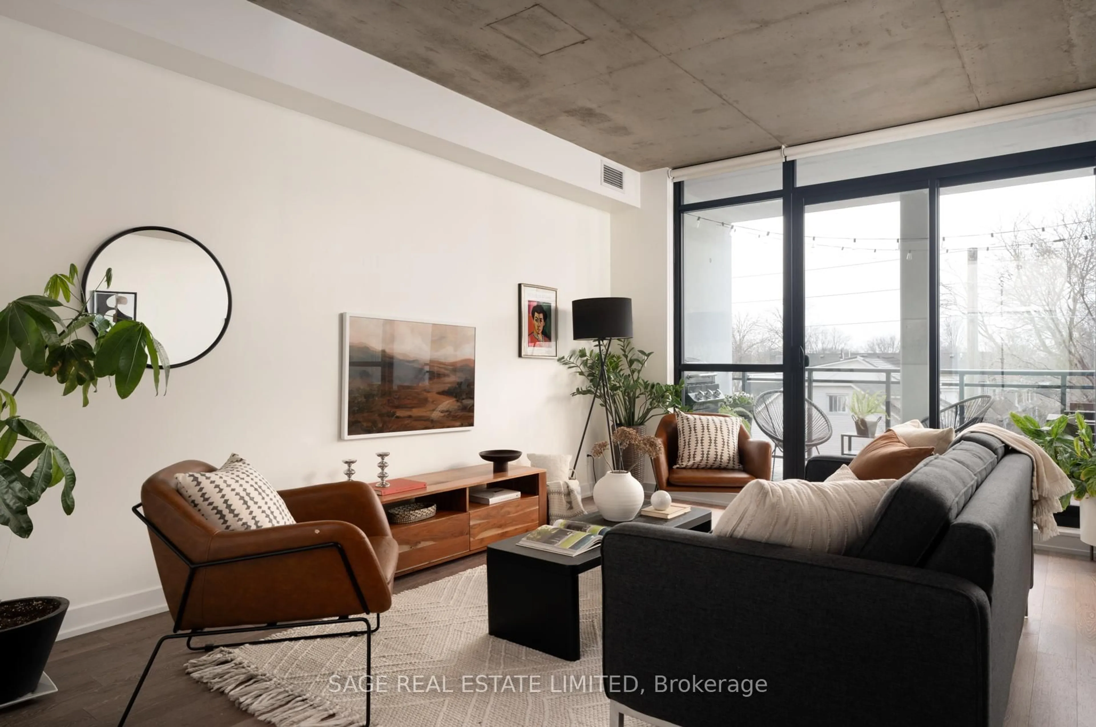 Living room with furniture, cement floor for 1238 Dundas St #403, Toronto Ontario M4M 1S3