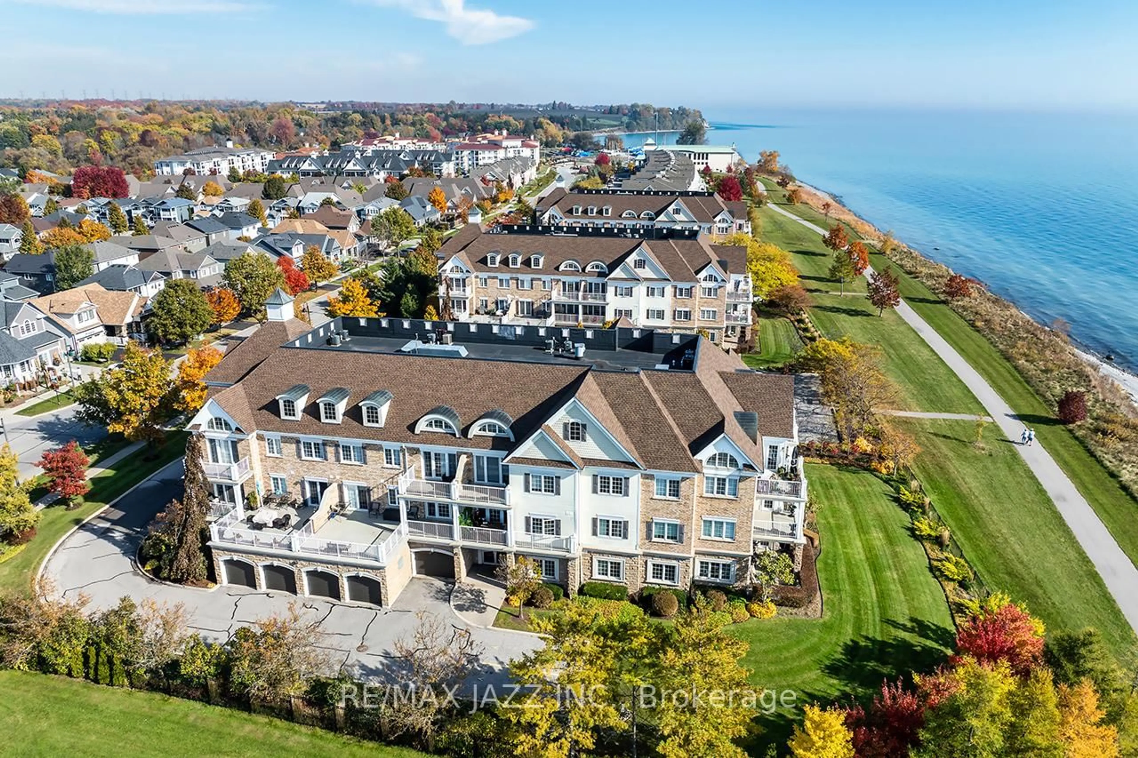 A pic from outside/outdoor area/front of a property/back of a property/a pic from drone, water/lake/river/ocean view for 375 Lakebreeze Dr #102, Clarington Ontario L1B 0A3