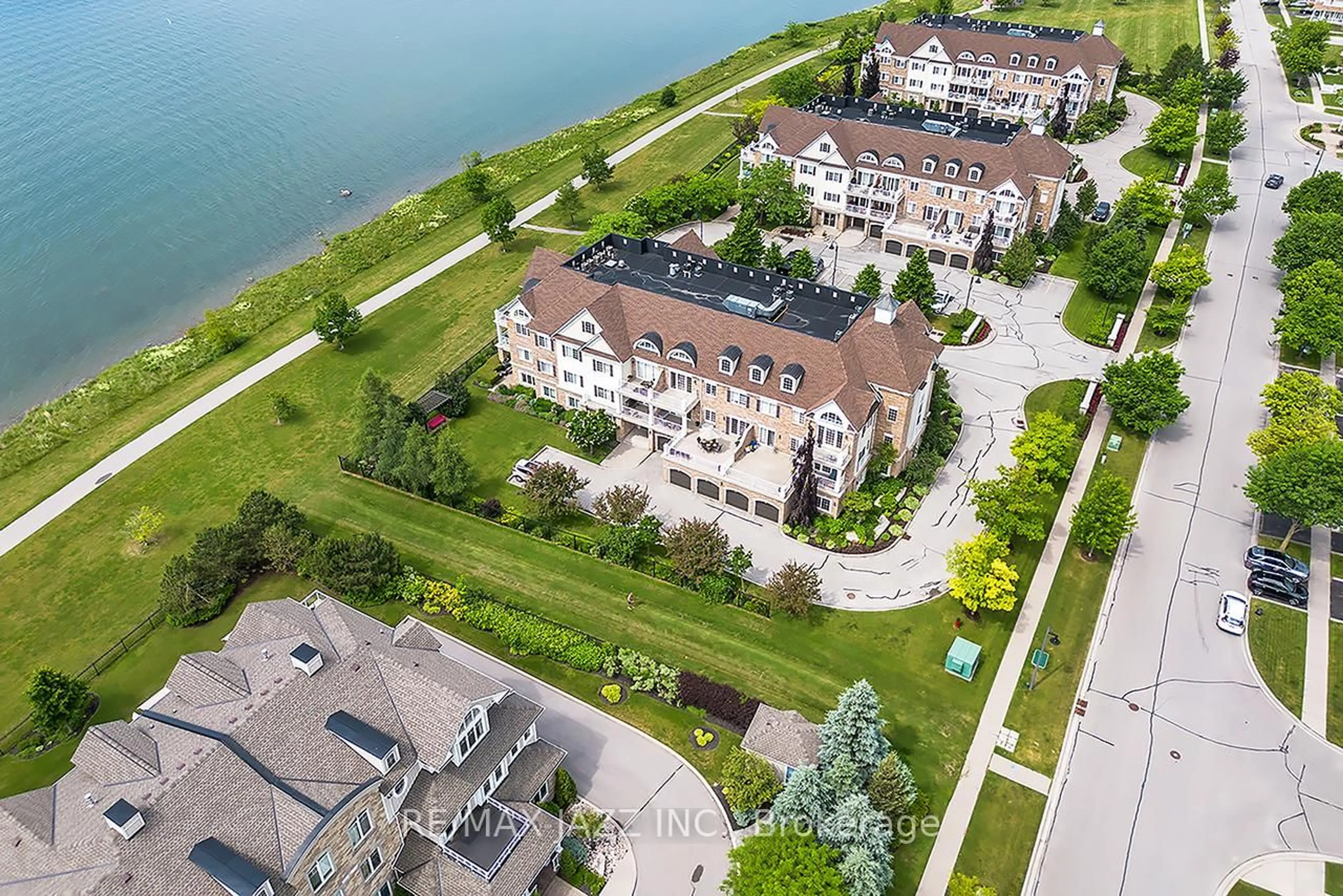 A pic from outside/outdoor area/front of a property/back of a property/a pic from drone, water/lake/river/ocean view for 375 Lakebreeze Dr #102, Clarington Ontario L1B 0A3