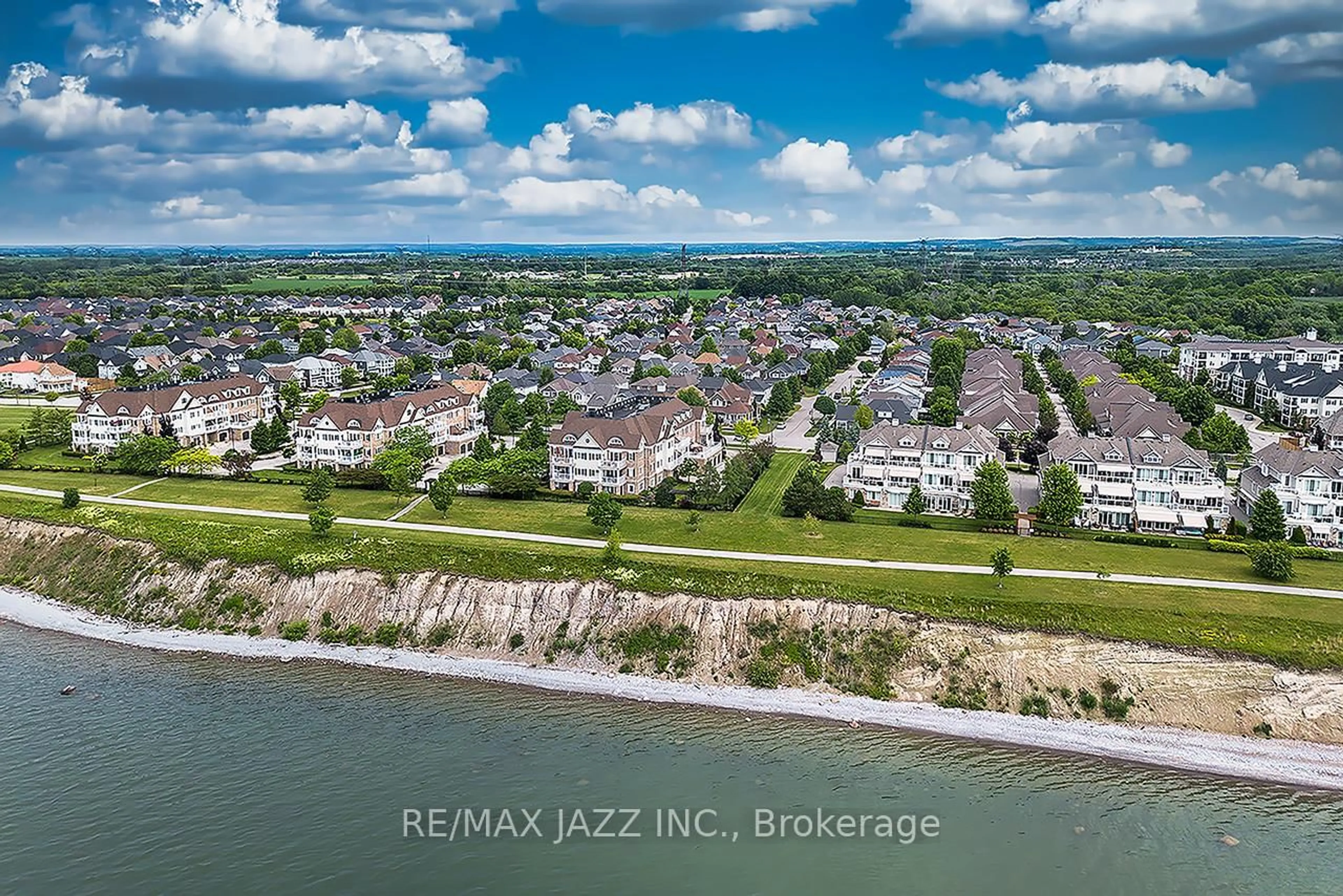 A pic from outside/outdoor area/front of a property/back of a property/a pic from drone, water/lake/river/ocean view for 375 Lakebreeze Dr #102, Clarington Ontario L1B 0A3
