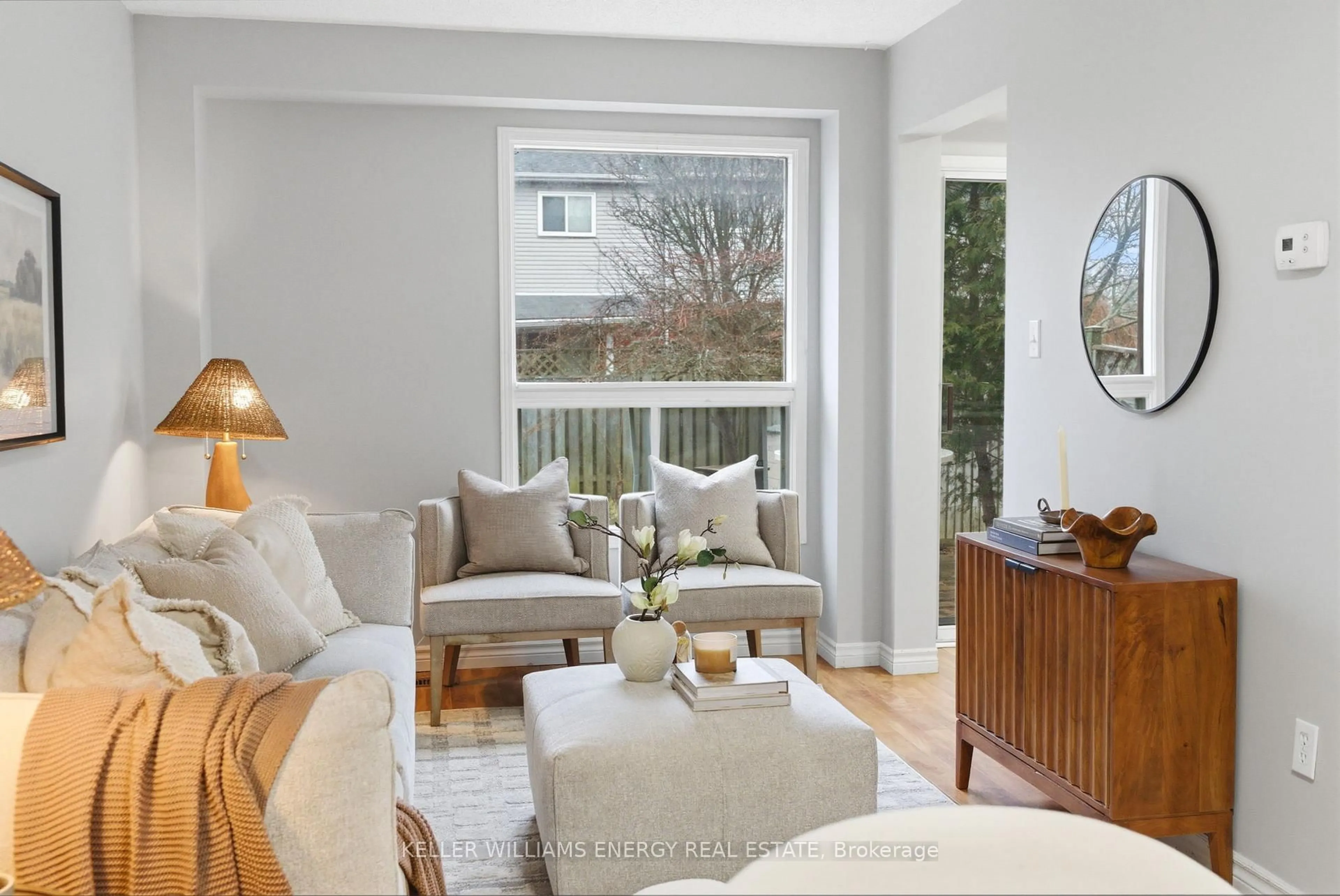 Living room with furniture, wood/laminate floor for 37 Moulton Crt, Clarington Ontario L1E 2W4