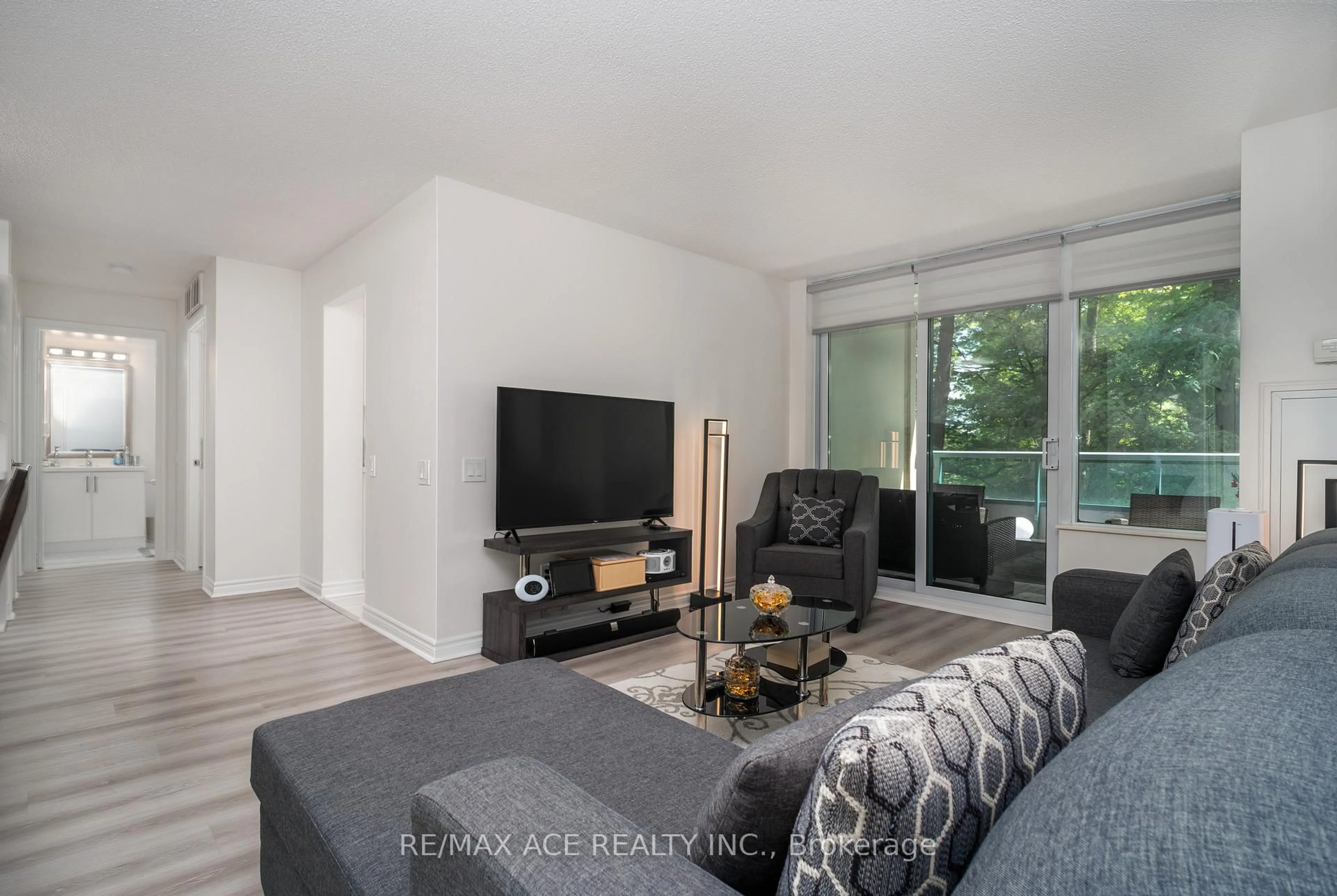 Living room with furniture, unknown for 61 Town Centre Crt #210, Toronto Ontario M1P 5C5