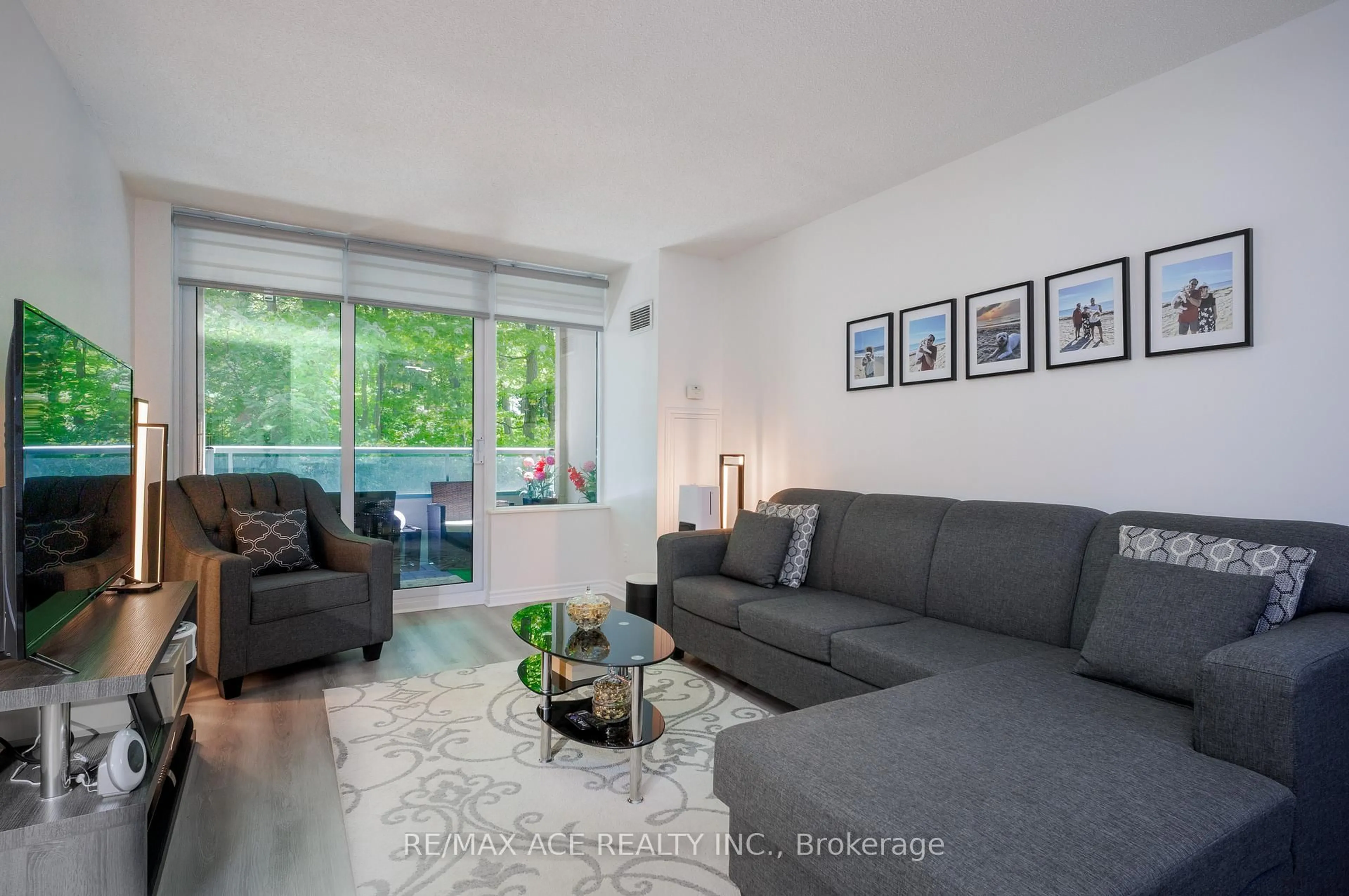 Living room with furniture, unknown for 61 Town Centre Crt #210, Toronto Ontario M1P 5C5