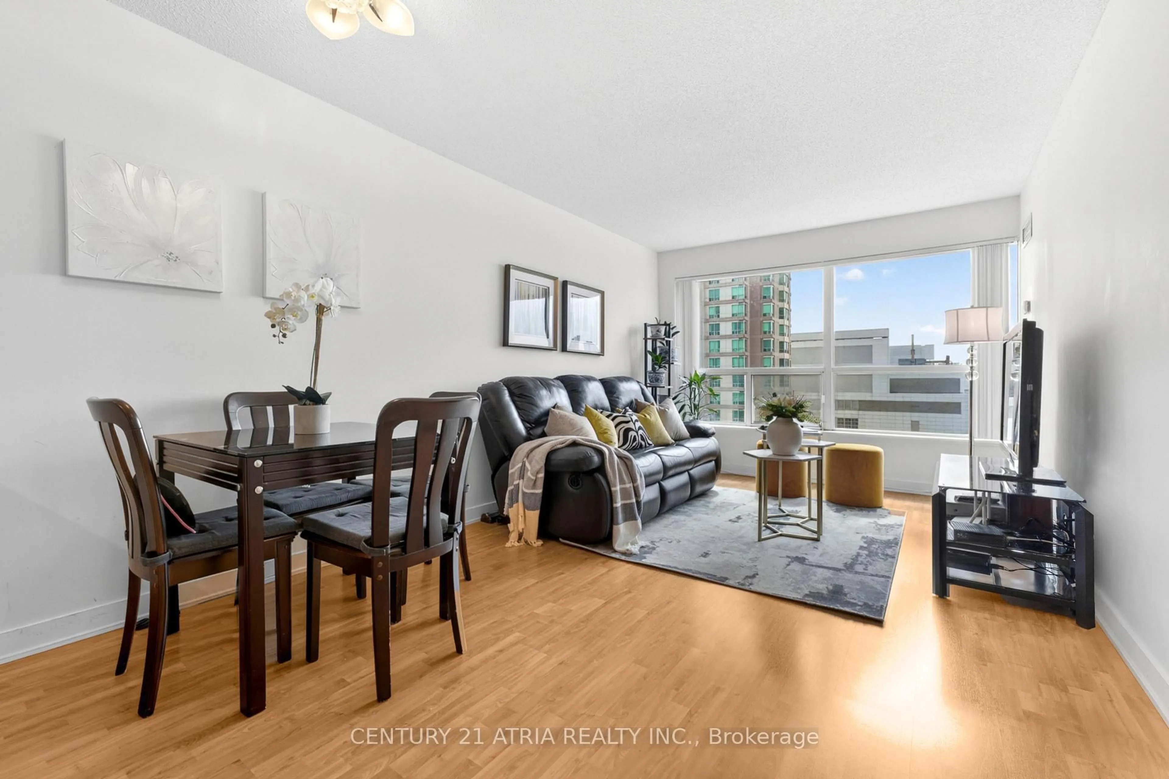 Living room with furniture, wood/laminate floor for 38 Lee Centre Dr #908, Toronto Ontario M1H 3J7