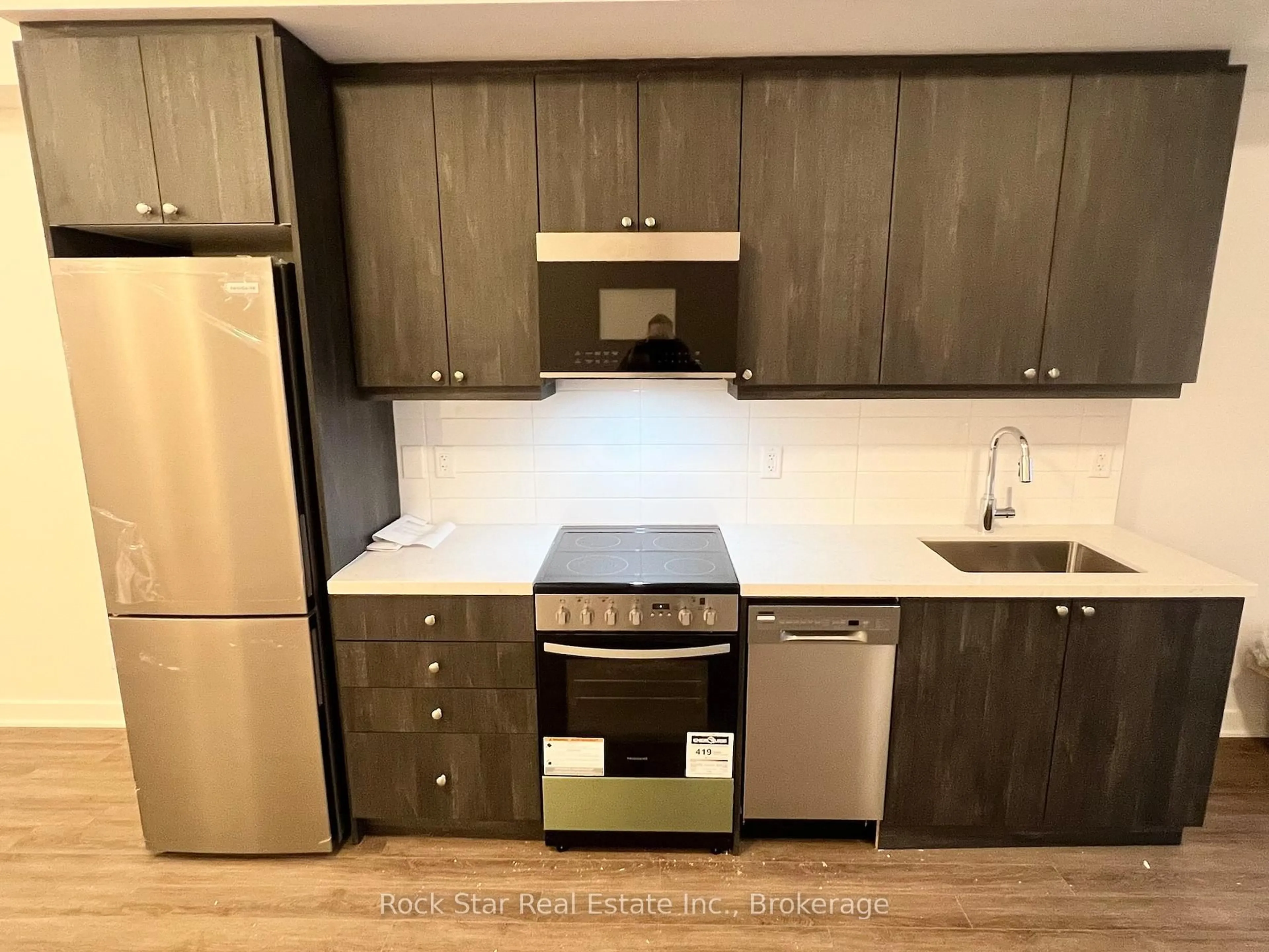 Standard kitchen, wood/laminate floor for 55 Clarington Blvd #306, Clarington Ontario L1C 7J4