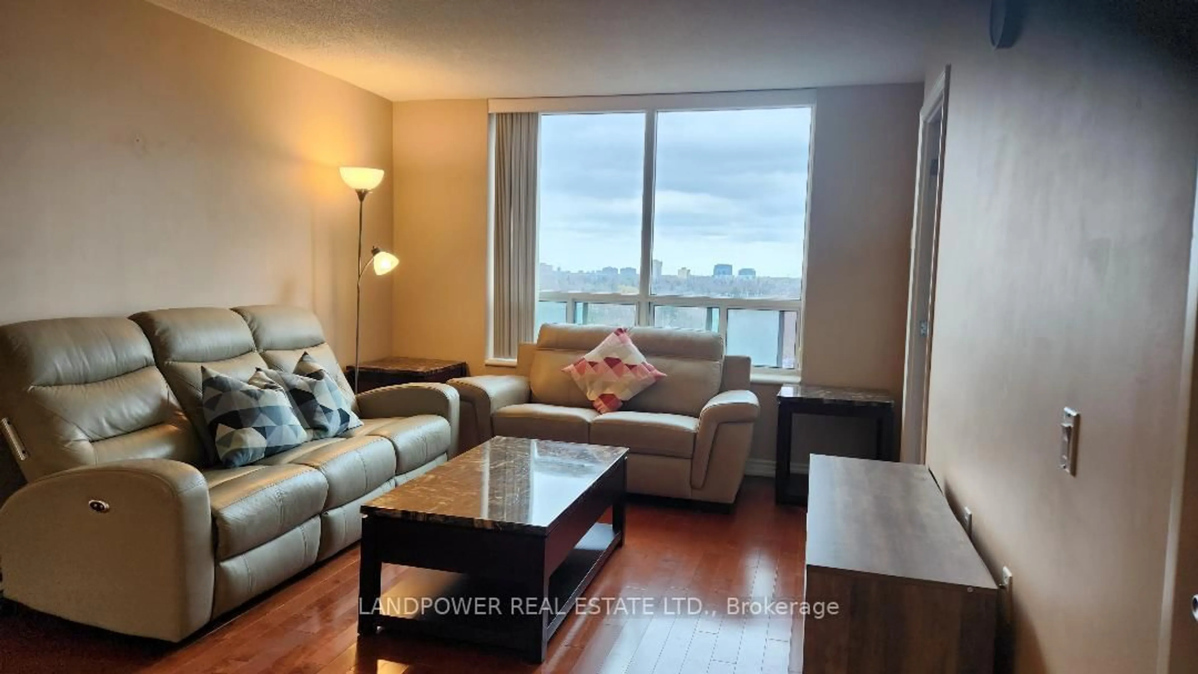 Living room with furniture, wood/laminate floor for 2800 Warden Ave #704, Toronto Ontario M1W 3Z6