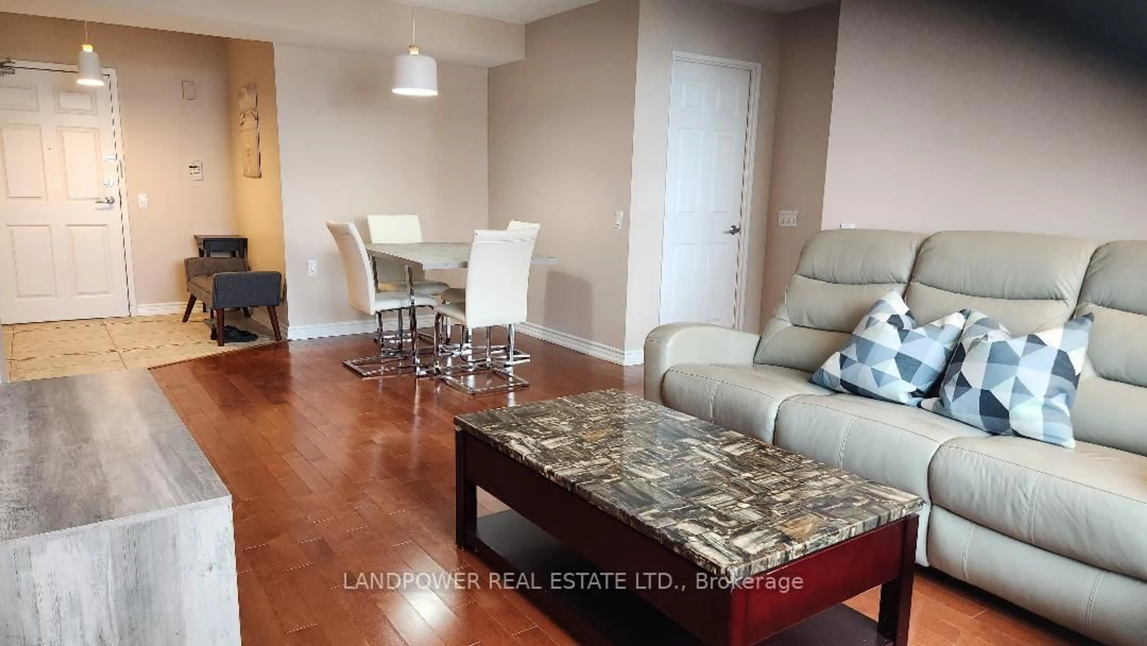 Living room with furniture, wood/laminate floor for 2800 Warden Ave #704, Toronto Ontario M1W 3Z6