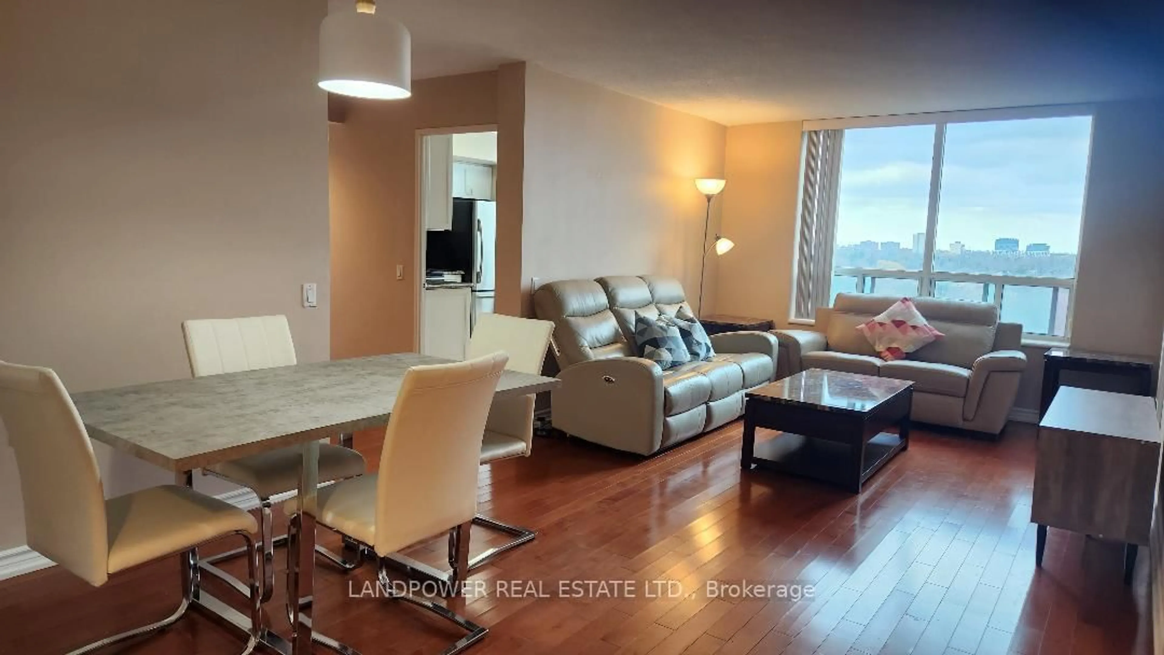 Living room with furniture, wood/laminate floor for 2800 Warden Ave #704, Toronto Ontario M1W 3Z6