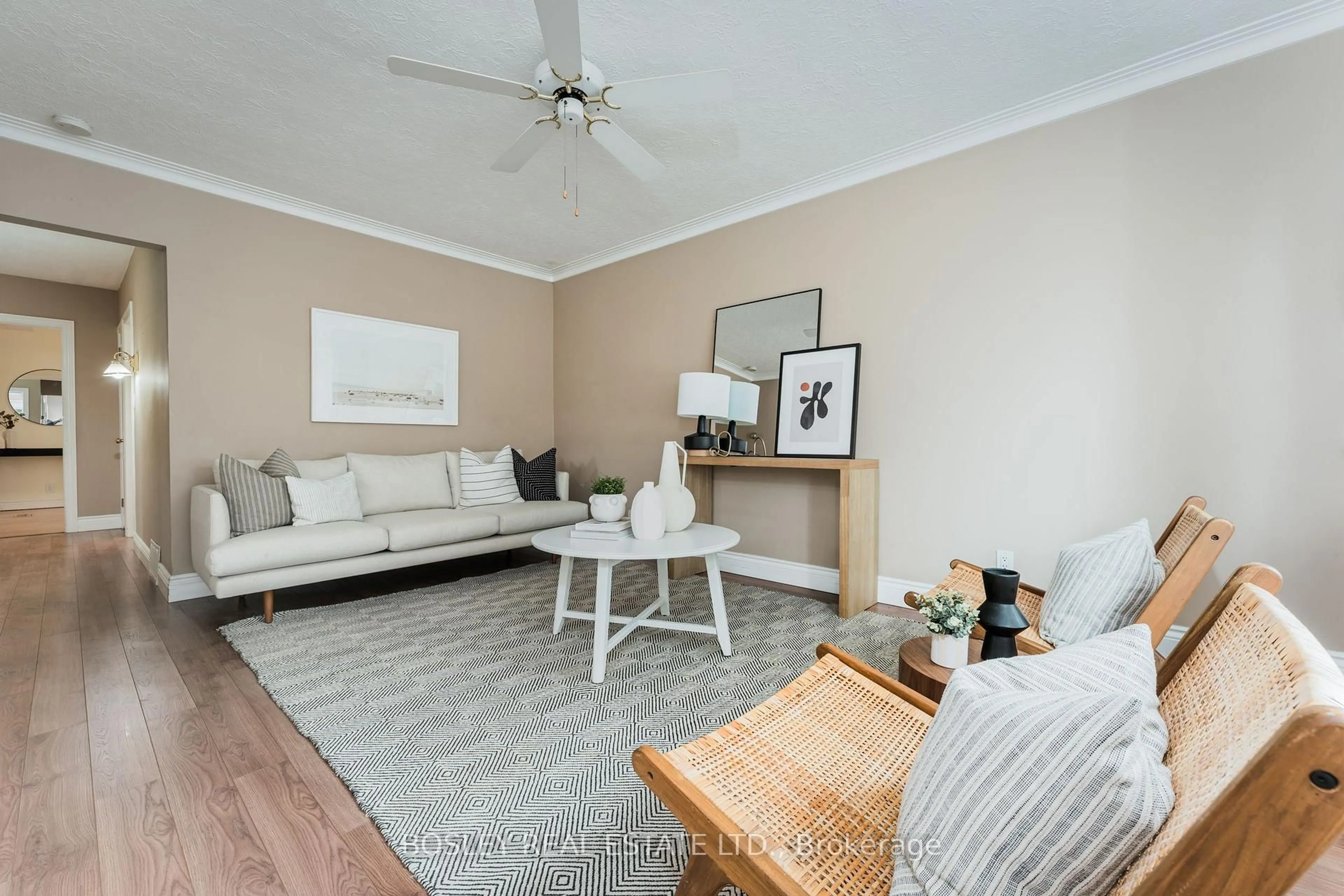 Living room with furniture, wood/laminate floor for 132 Aylesworth Ave, Toronto Ontario M1N 2J6