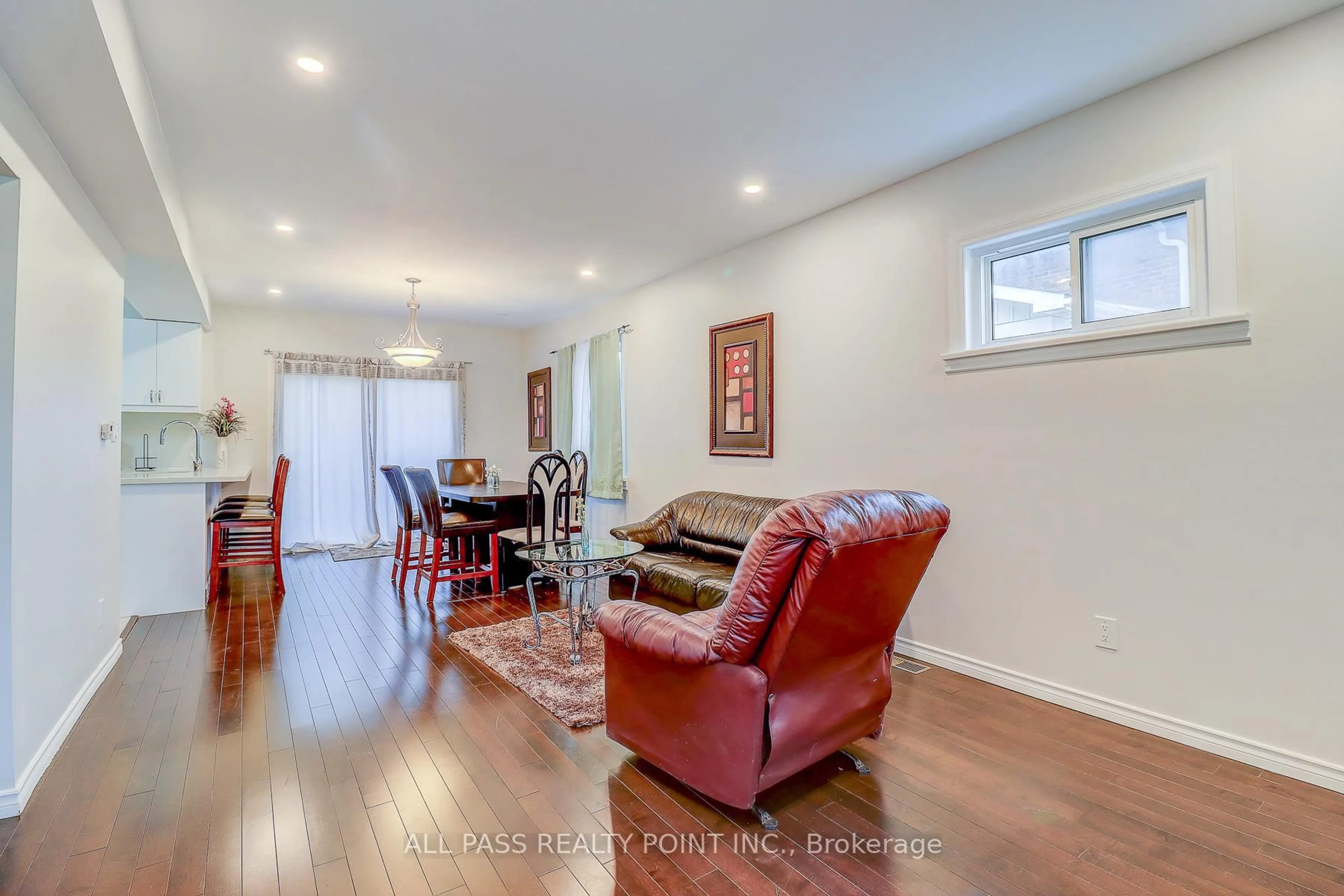 Living room with furniture, wood/laminate floor for 104 Conant St, Oshawa Ontario L1H 3R6