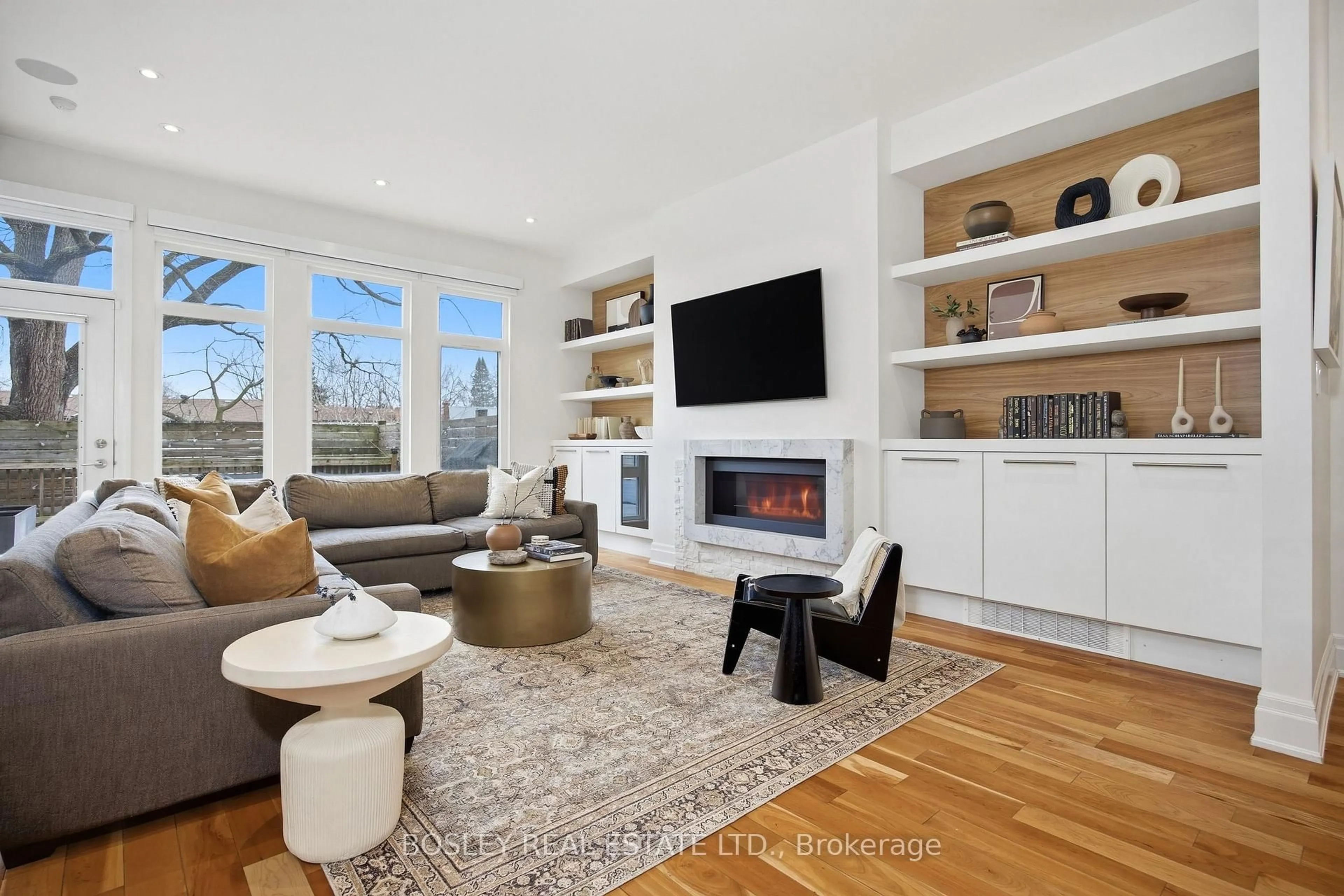 Living room with furniture, wood/laminate floor for 17 Vince Ave, Toronto Ontario M4L 0A6
