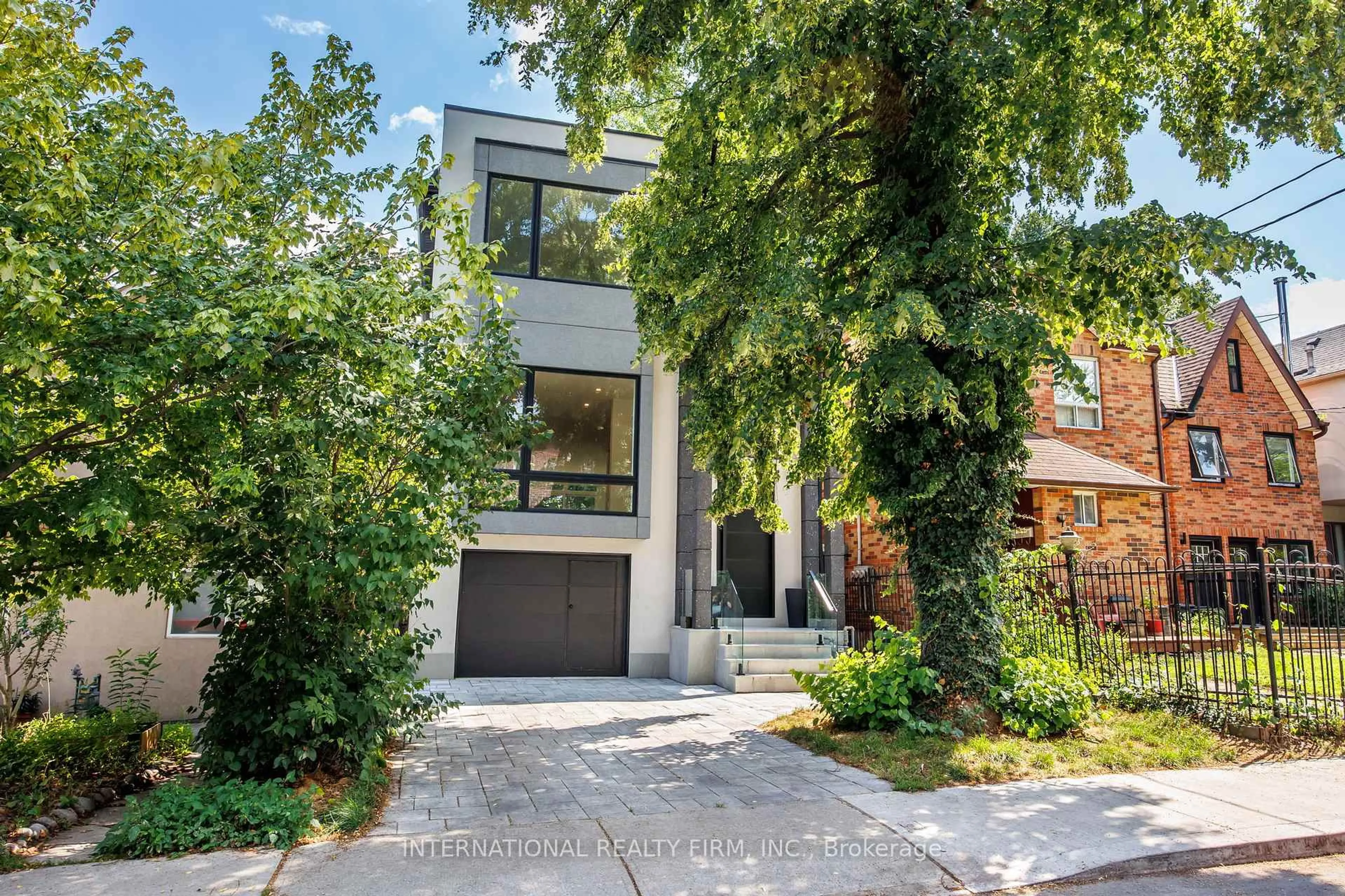 Home with brick exterior material, street for 19 Ivy Ave, Toronto Ontario M4L 2H6