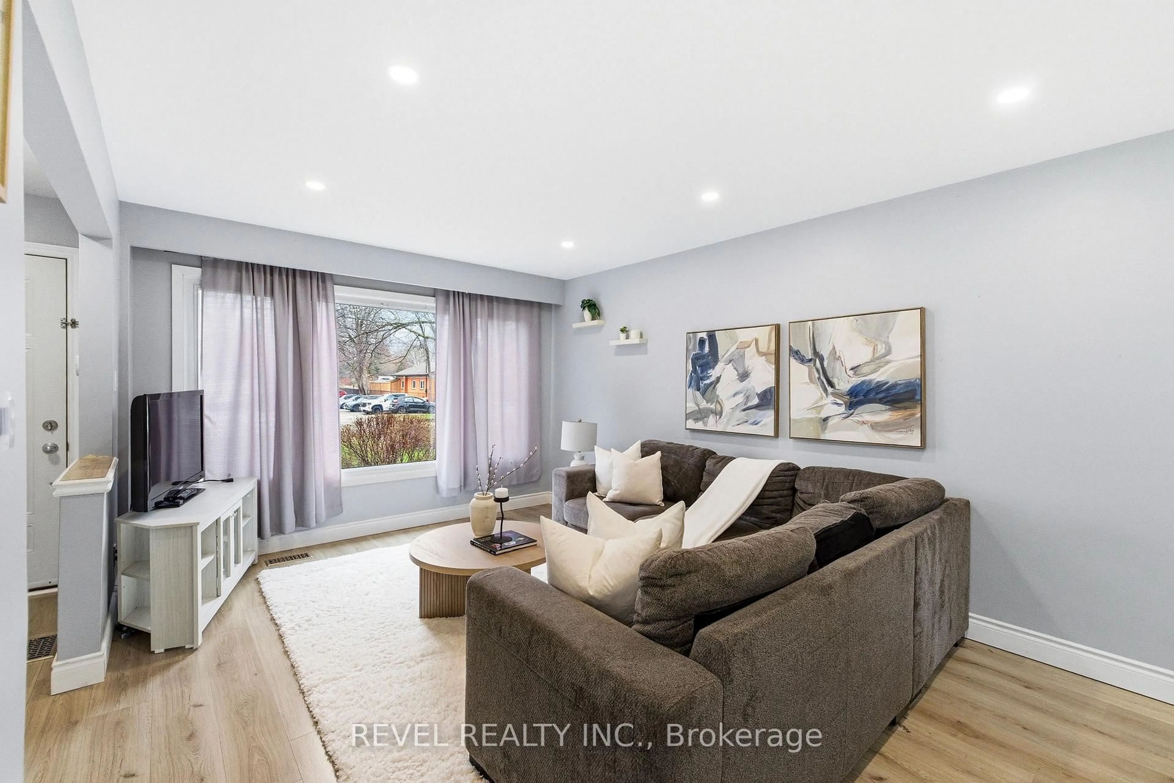 Living room with furniture, wood/laminate floor for 396 Wilson Rd, Oshawa Ontario L1G 6E5