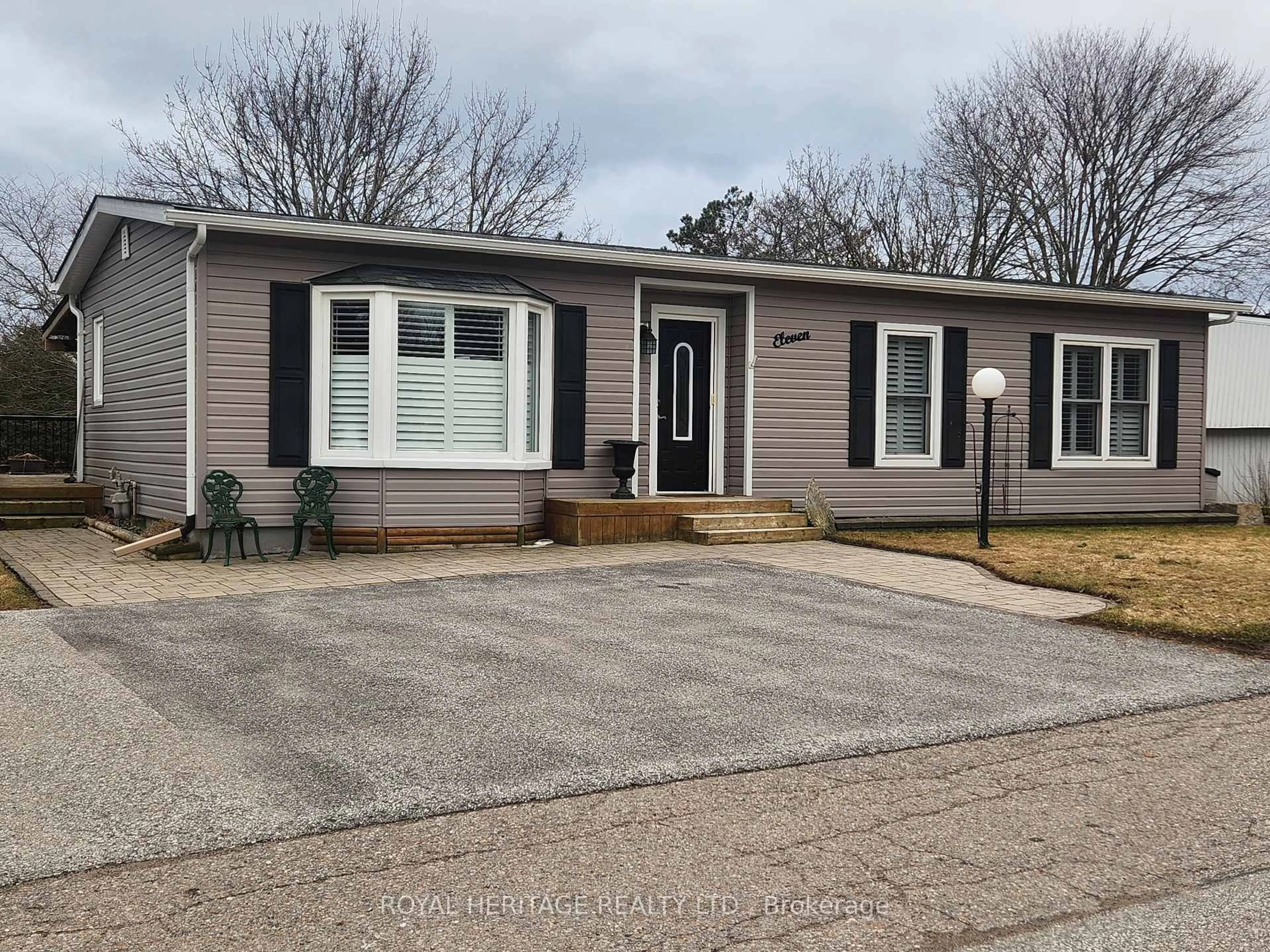 Home with vinyl exterior material, street for 11 Heritage Lane, Clarington Ontario L1B 1A5