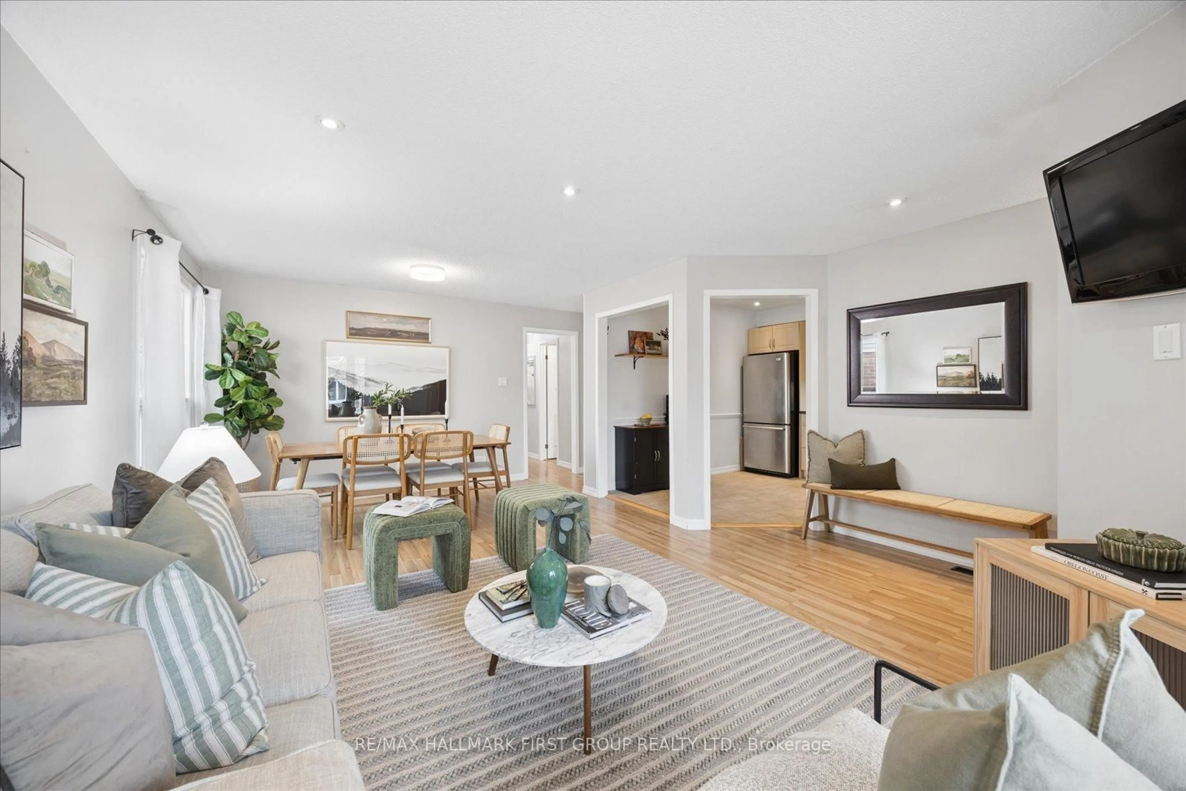 Living room with furniture, wood/laminate floor for 56 Longstaff Dr, Ajax Ontario L1S 5J7