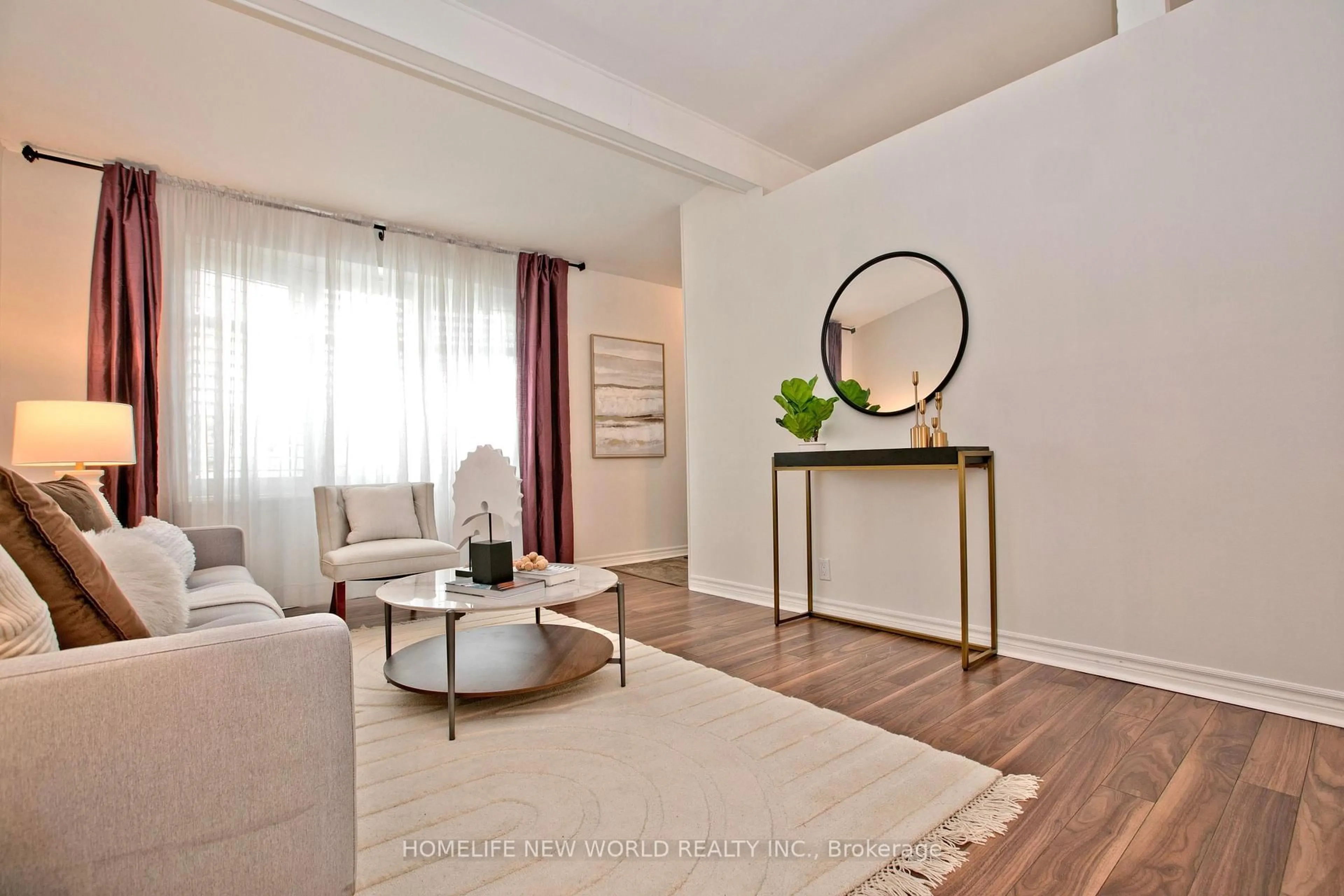 Living room with furniture, wood/laminate floor for 680 Annland St, Pickering Ontario L1W 1B2