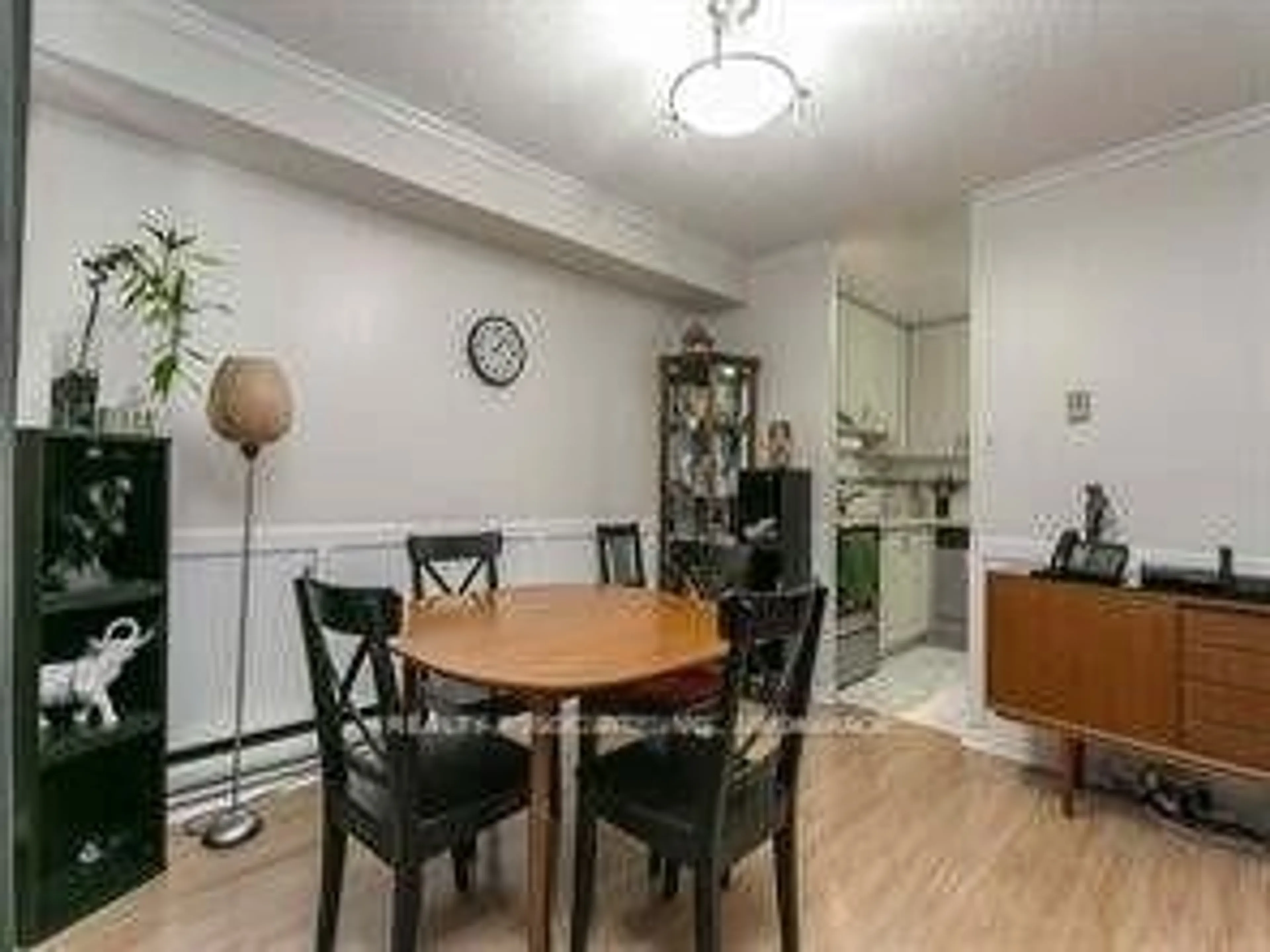 Dining room, wood/laminate floor for 2500 Bridletowne Circ #107, Toronto Ontario M1W 2V6