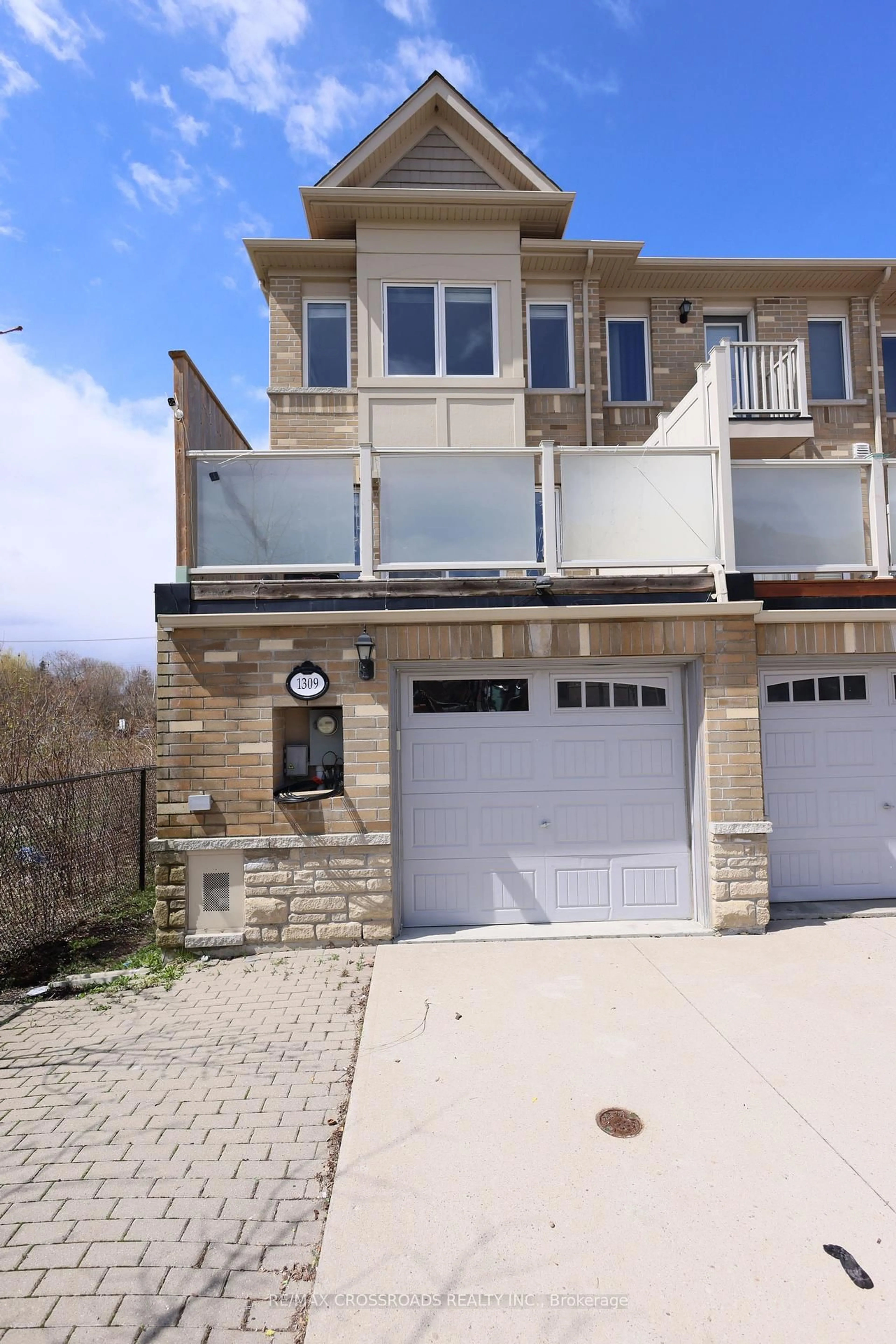 Home with brick exterior material, street for 1309 Danforth Rd, Toronto Ontario M1J 0B1