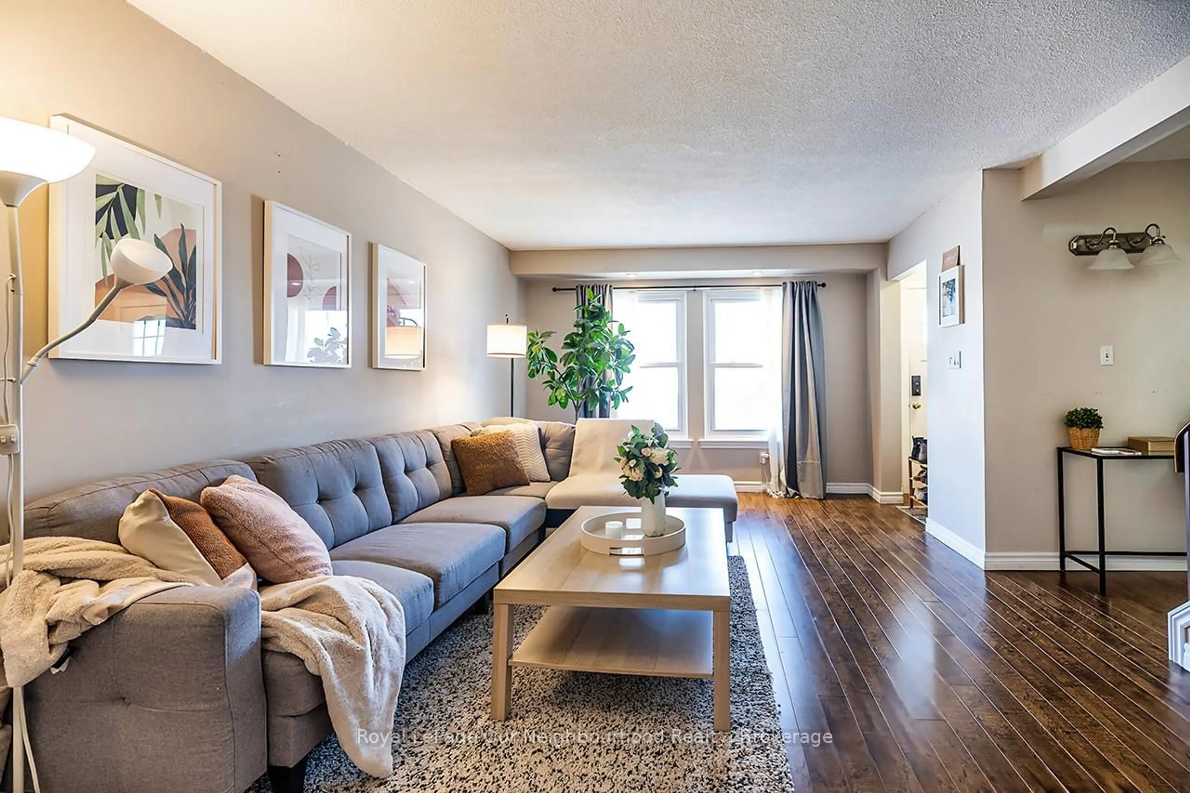 Living room with furniture, wood/laminate floor for 976 Southport Dr, Oshawa Ontario L1H 8A3