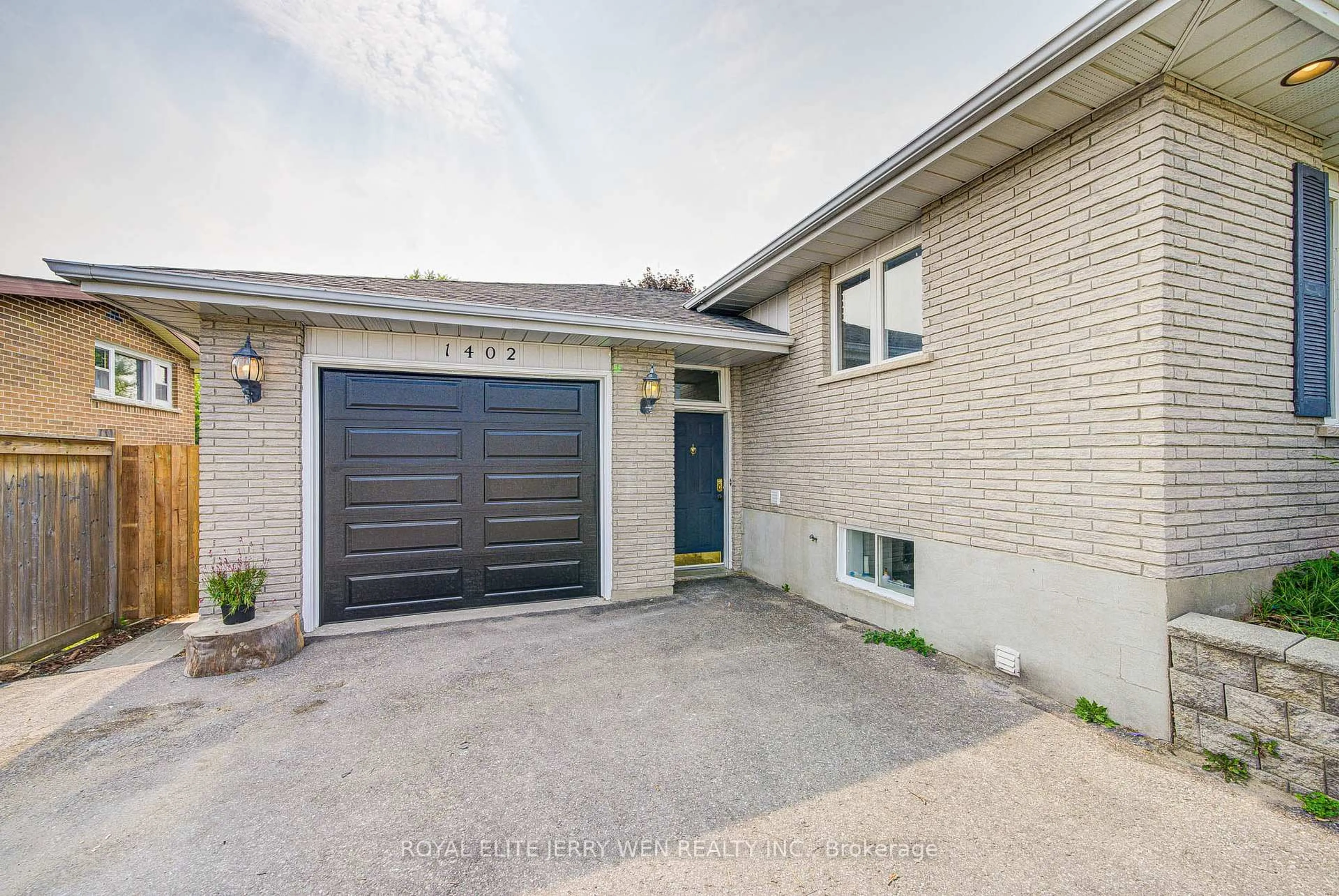 Home with brick exterior material, street for 1402 Wilson Rd, Oshawa Ontario L1K 2B9