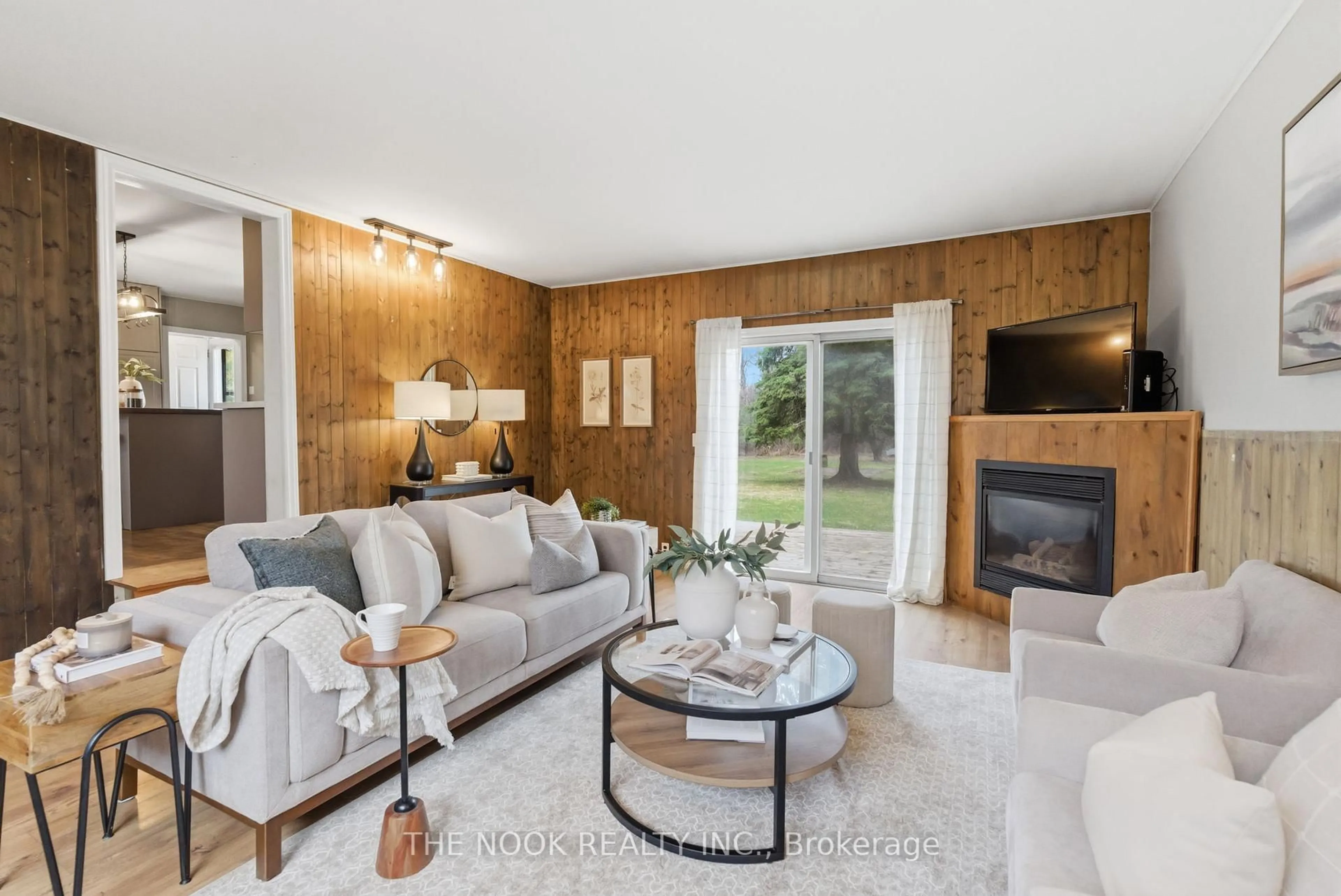 Living room with furniture, wood/laminate floor for 3824 Trulls Rd, Clarington Ontario L1E 2L3