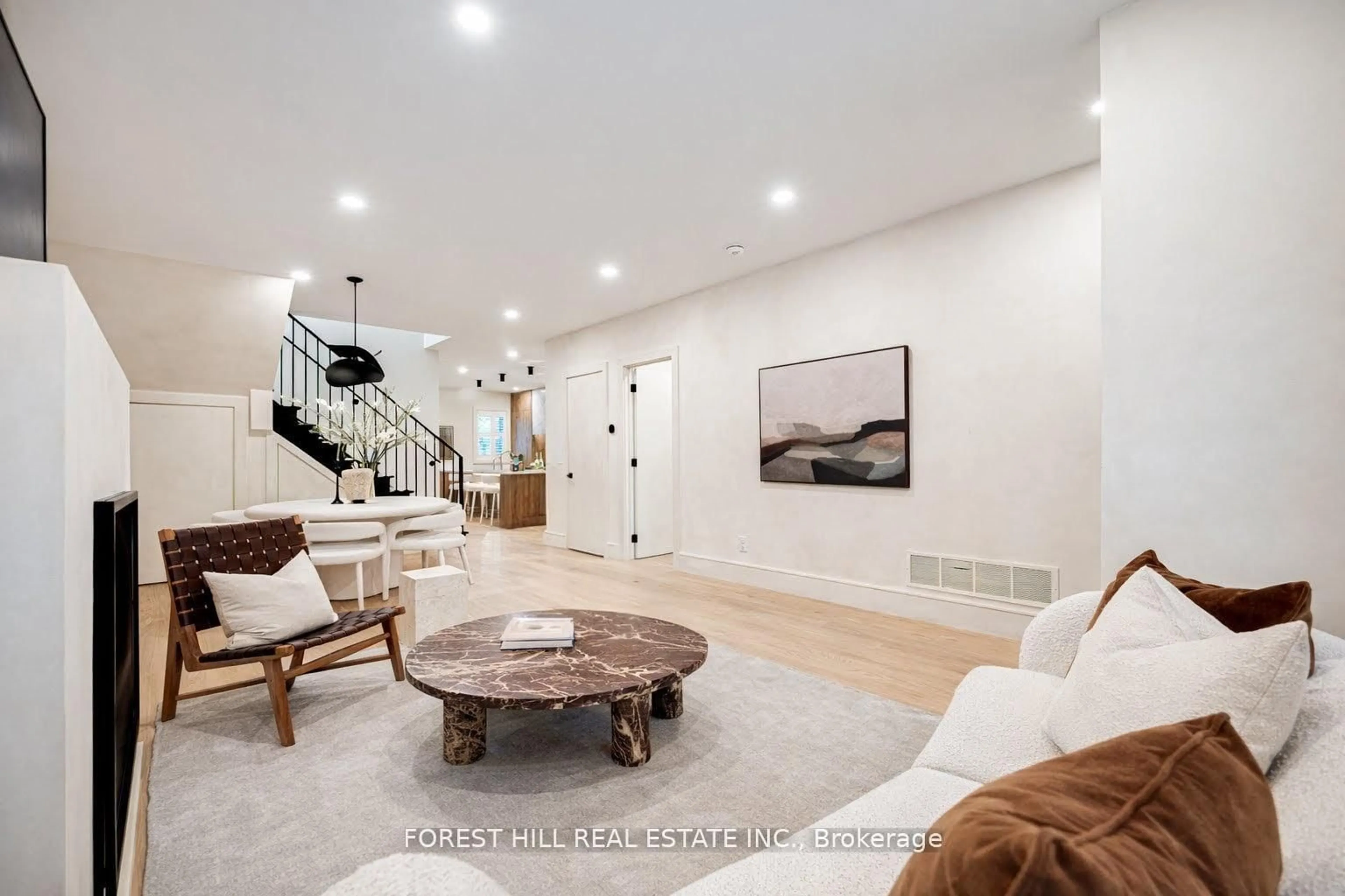 Living room with furniture, ceramic/tile floor for 295 Strathmore Blvd, Toronto Ontario M4J 1P9