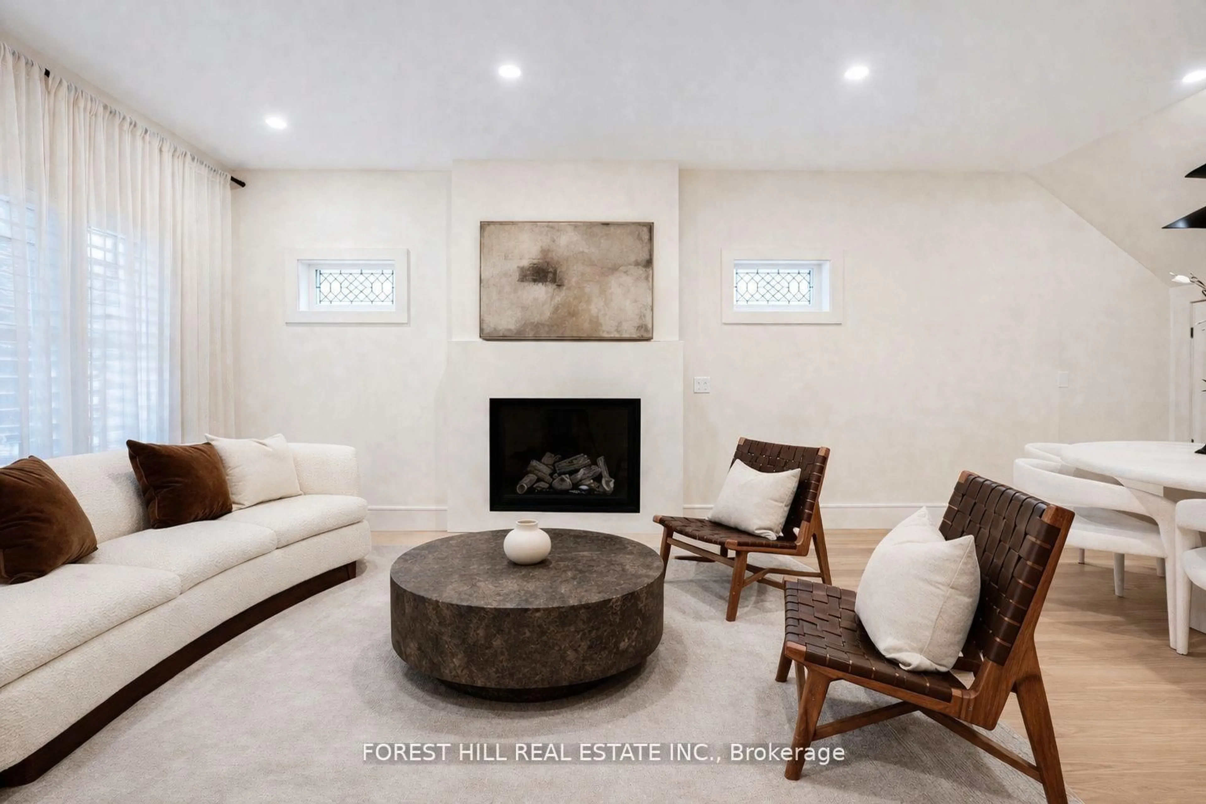 Living room with furniture, ceramic/tile floor for 295 Strathmore Blvd, Toronto Ontario M4J 1P9