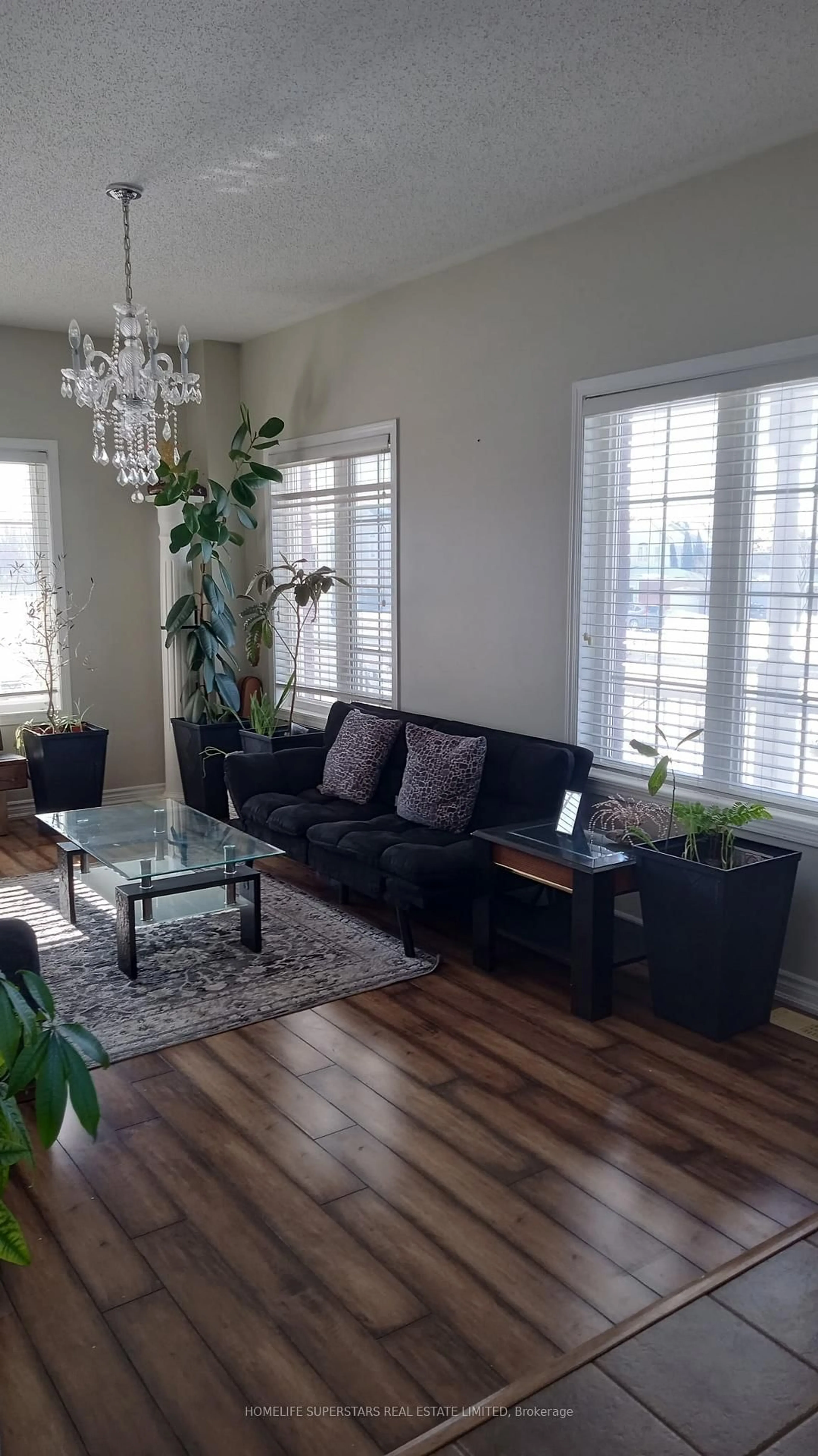 Living room with furniture, wood/laminate floor for 1316 Macinally Crt, Oshawa Ontario L1K 0B6