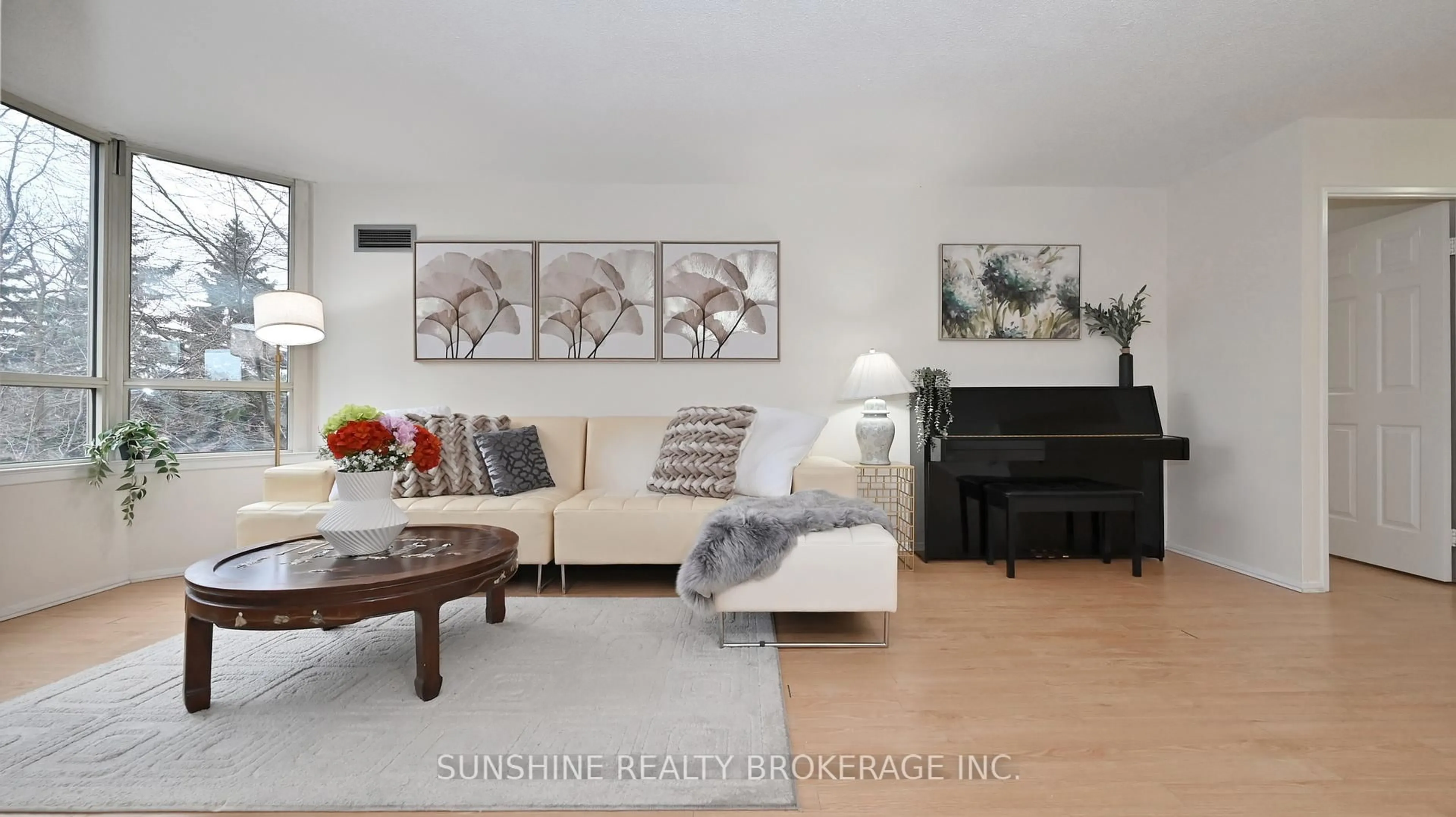 Living room with furniture, wood/laminate floor for 175 Bamburgh Circ #309, Toronto Ontario M1W 3X8