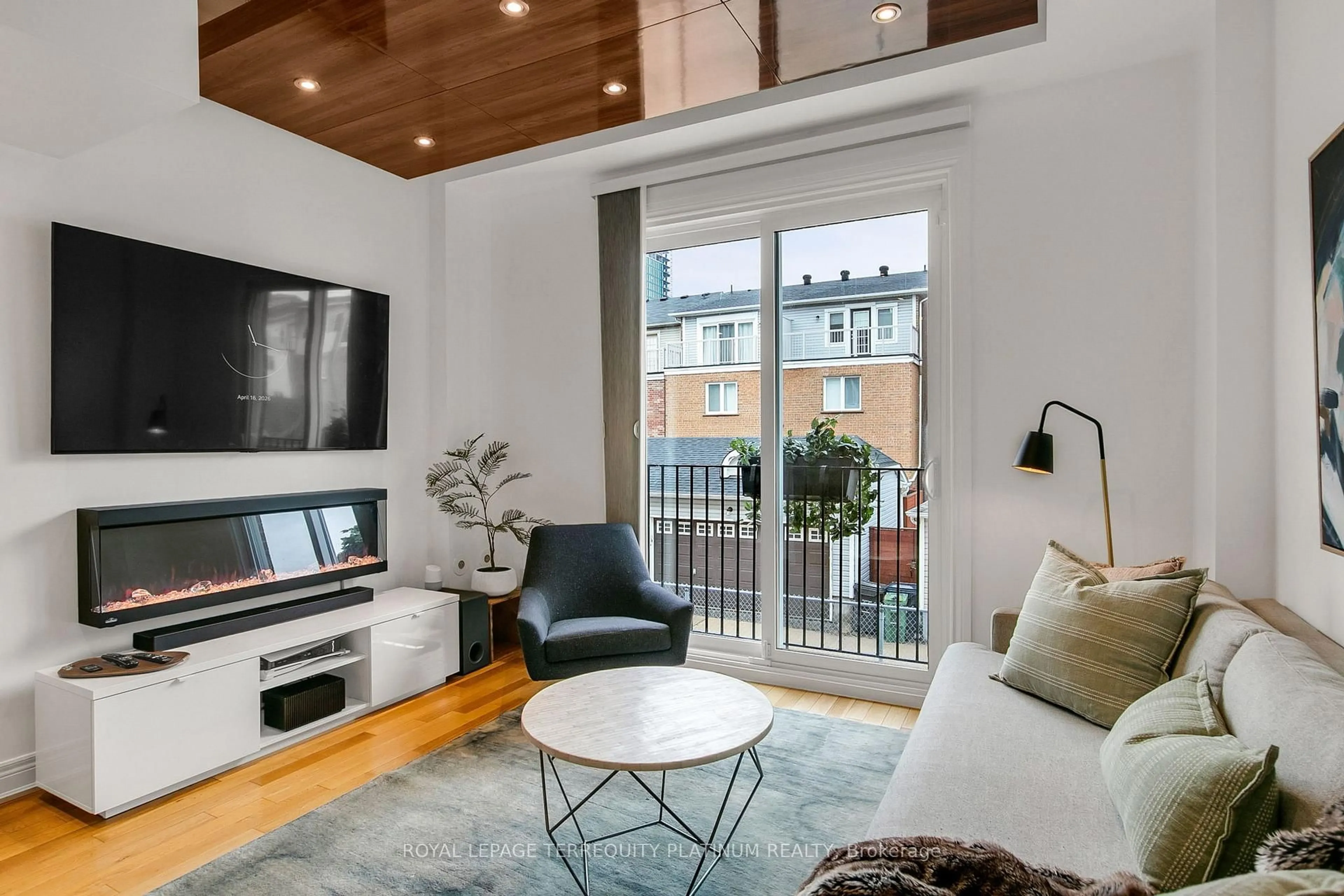 Living room with furniture, wood/laminate floor for 22 Fairhead Mews, Toronto Ontario M4E 3Y4