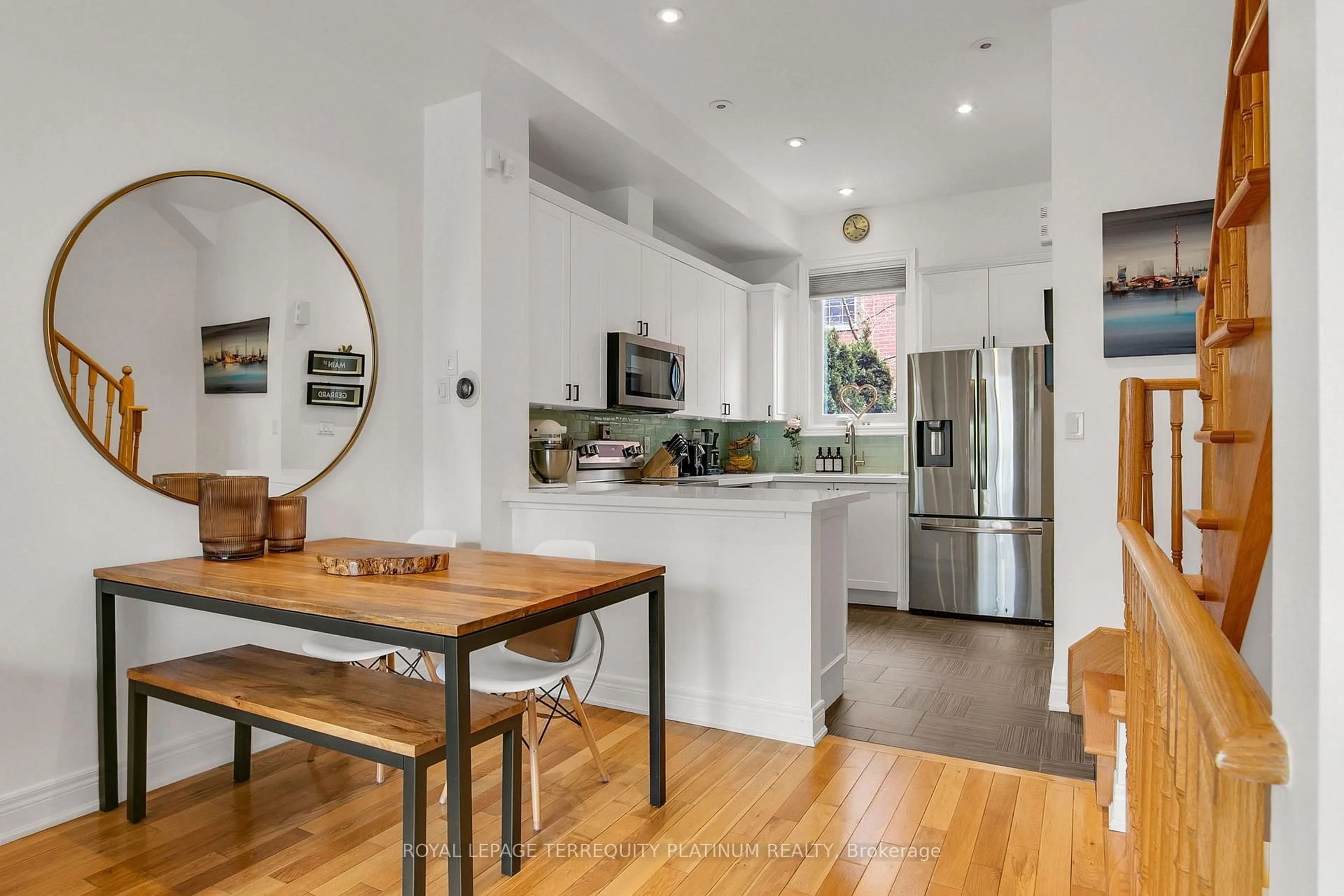 Open concept kitchen, wood/laminate floor for 22 Fairhead Mews, Toronto Ontario M4E 3Y4