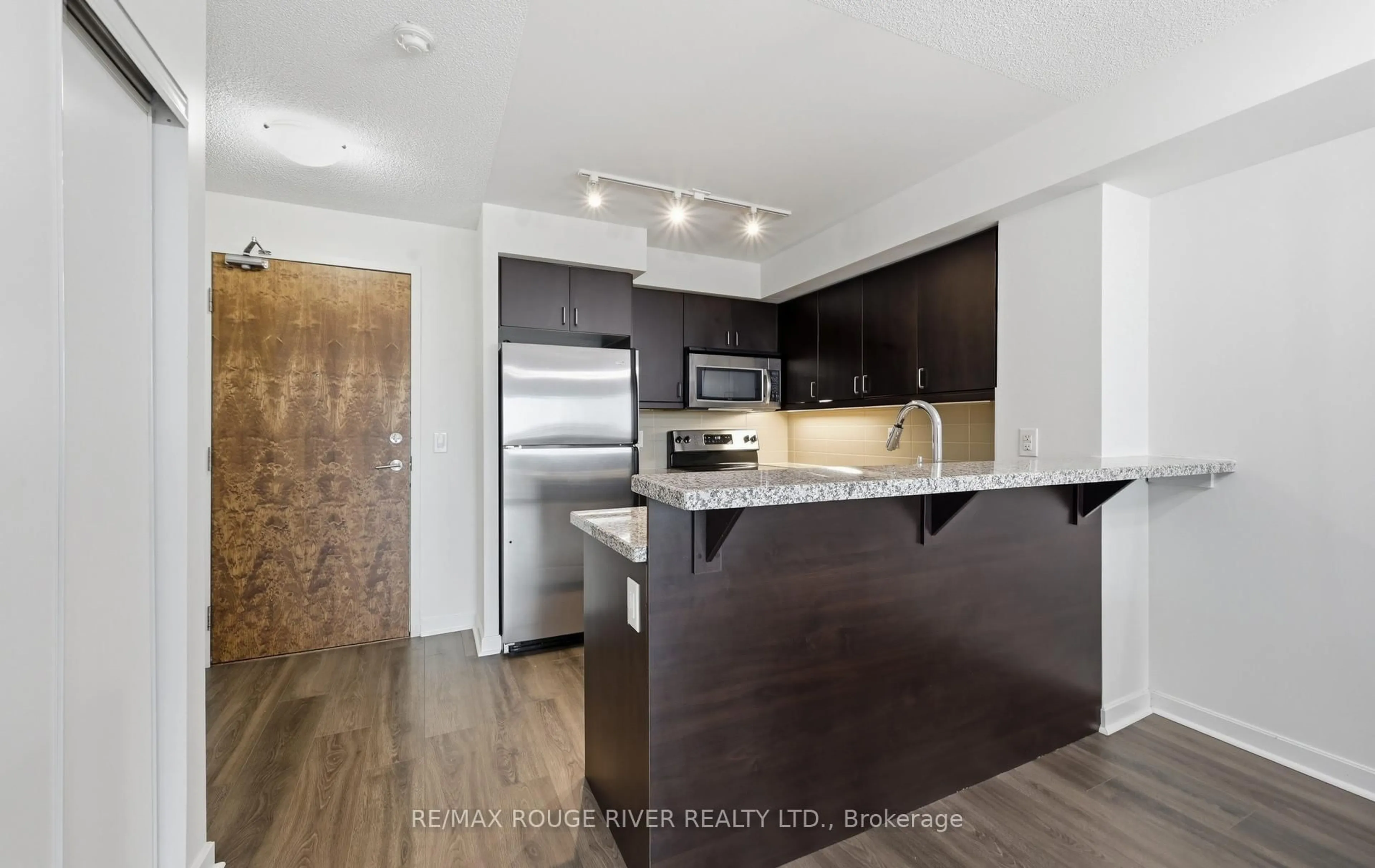 Open concept kitchen, wood/laminate floor for 1235 Bayly St #414, Pickering Ontario L1W 1L7