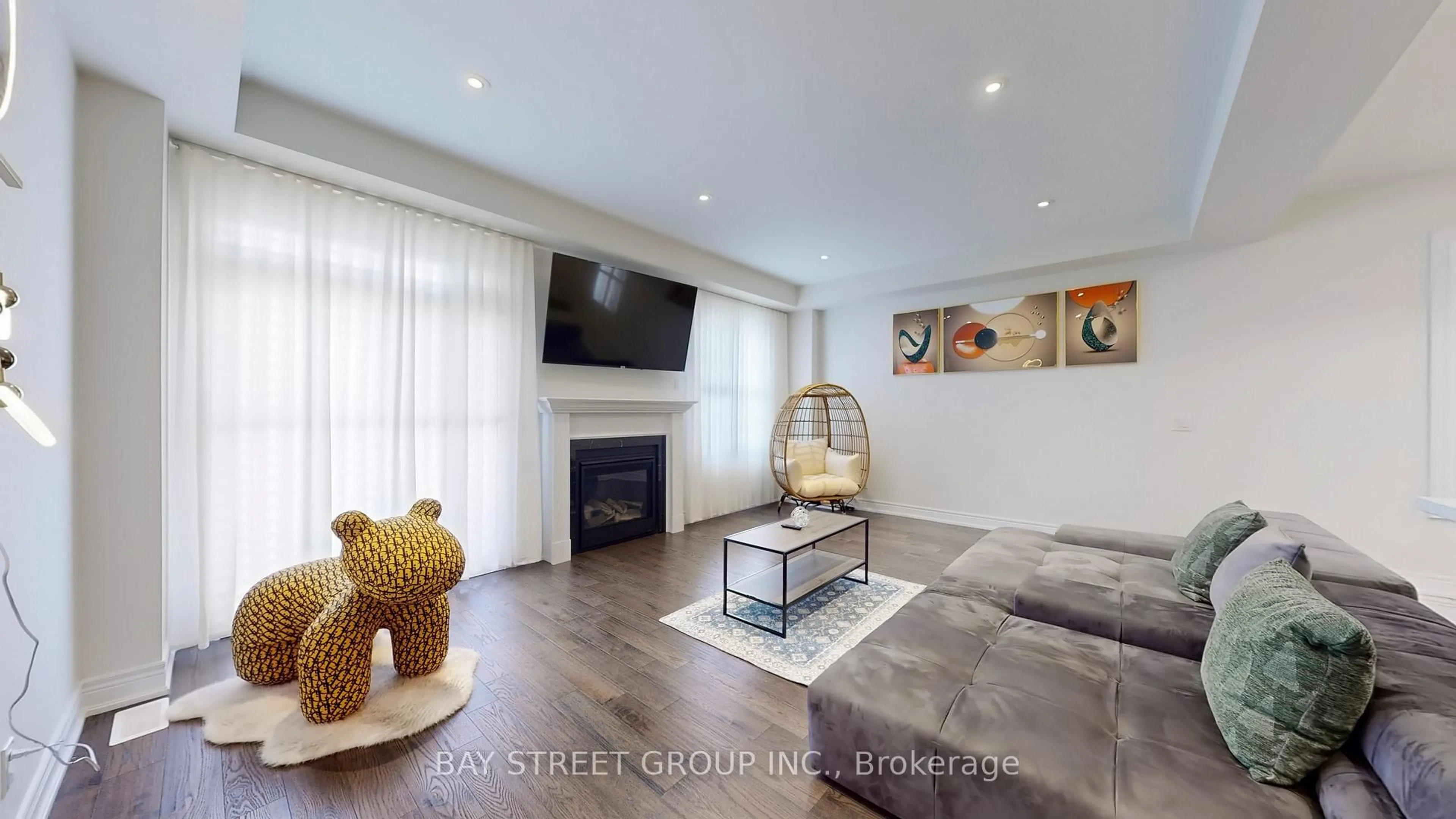 Living room with furniture, wood/laminate floor for 110 Christine Elliott Ave, Whitby Ontario L1P 0E1