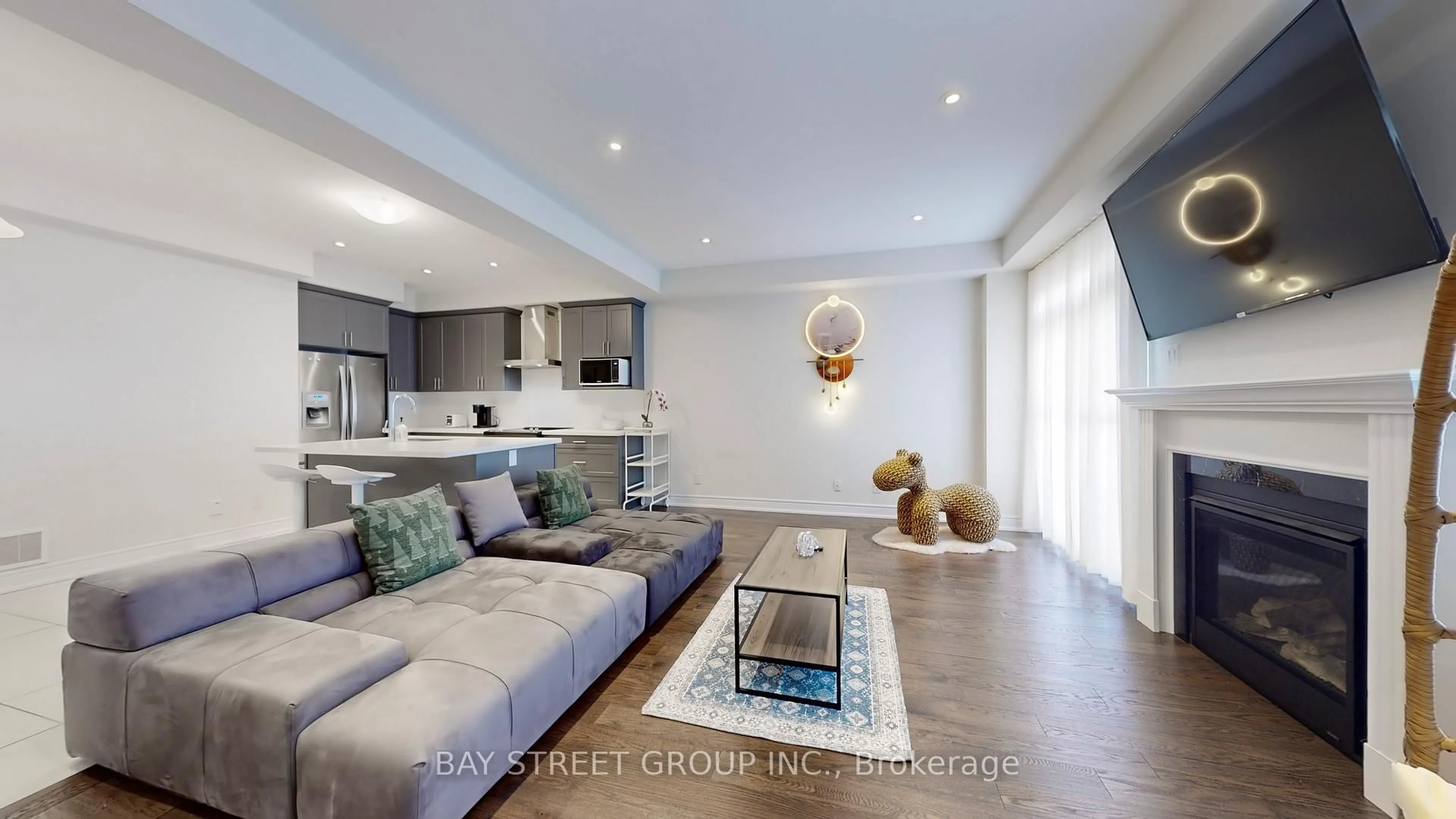 Living room with furniture, wood/laminate floor for 110 Christine Elliott Ave, Whitby Ontario L1P 0E1