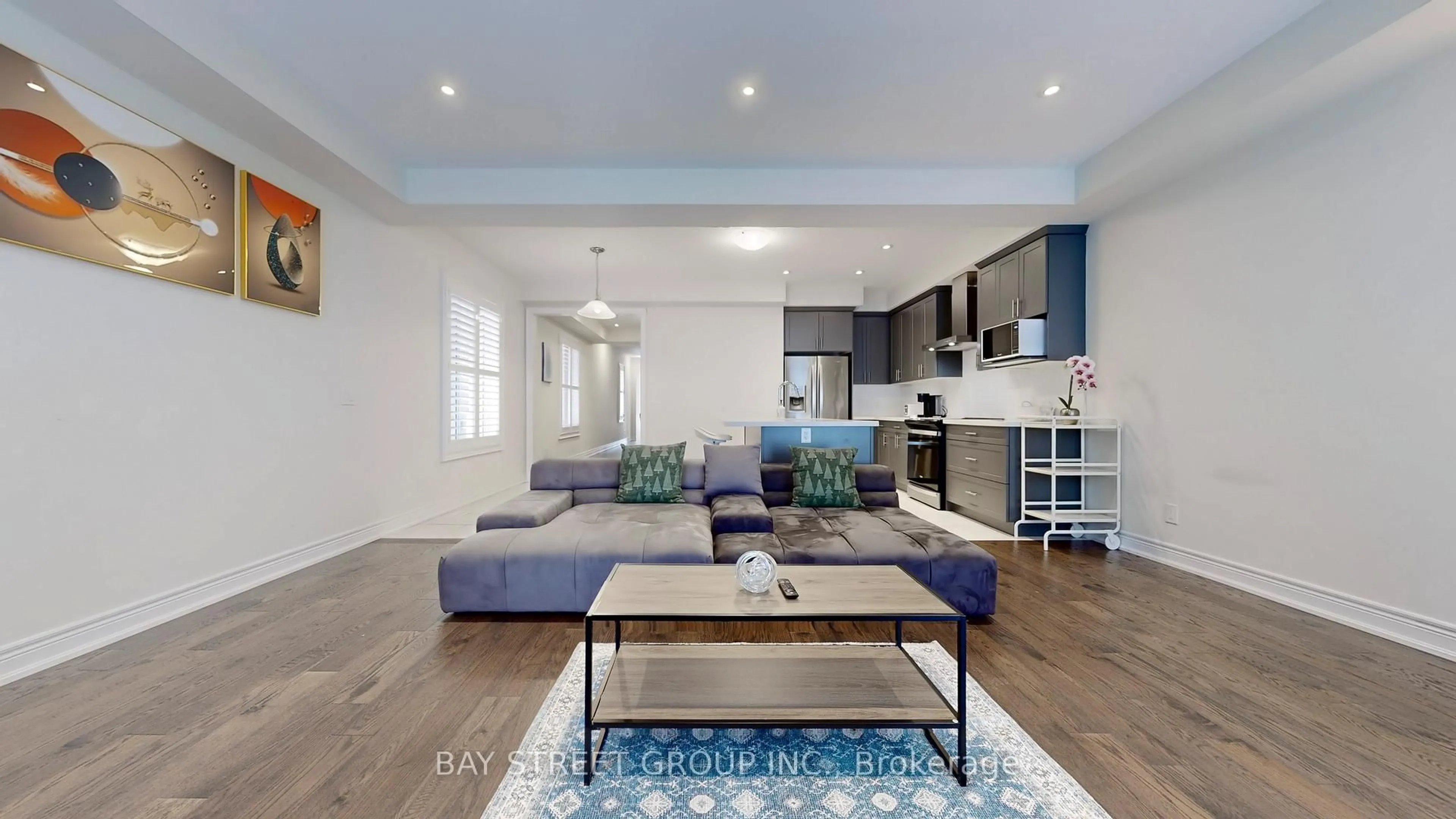 Living room with furniture, wood/laminate floor for 110 Christine Elliott Ave, Whitby Ontario L1P 0E1