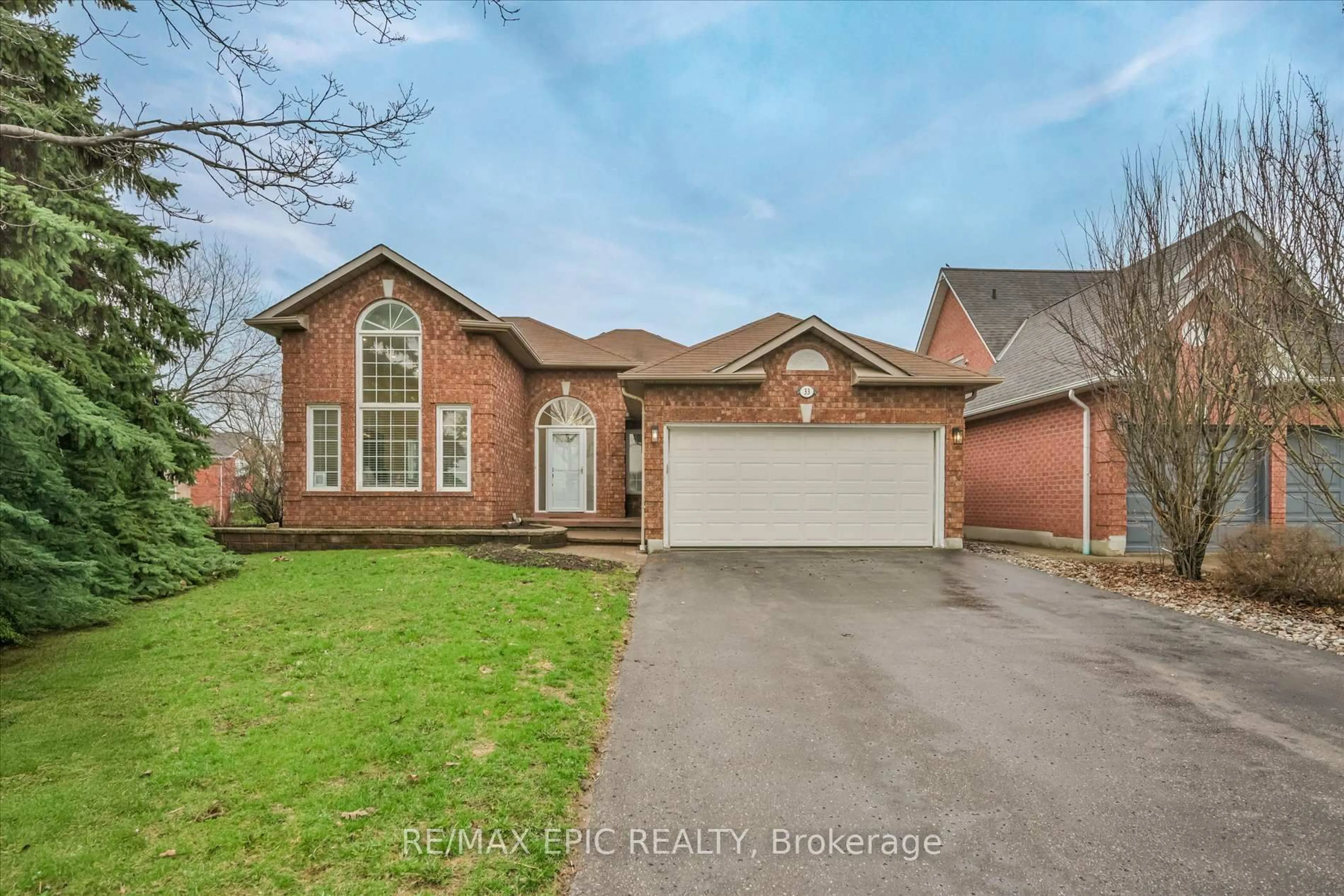Home with brick exterior material, street for 33 EMMETT Pl, Whitby Ontario L1R 2B4
