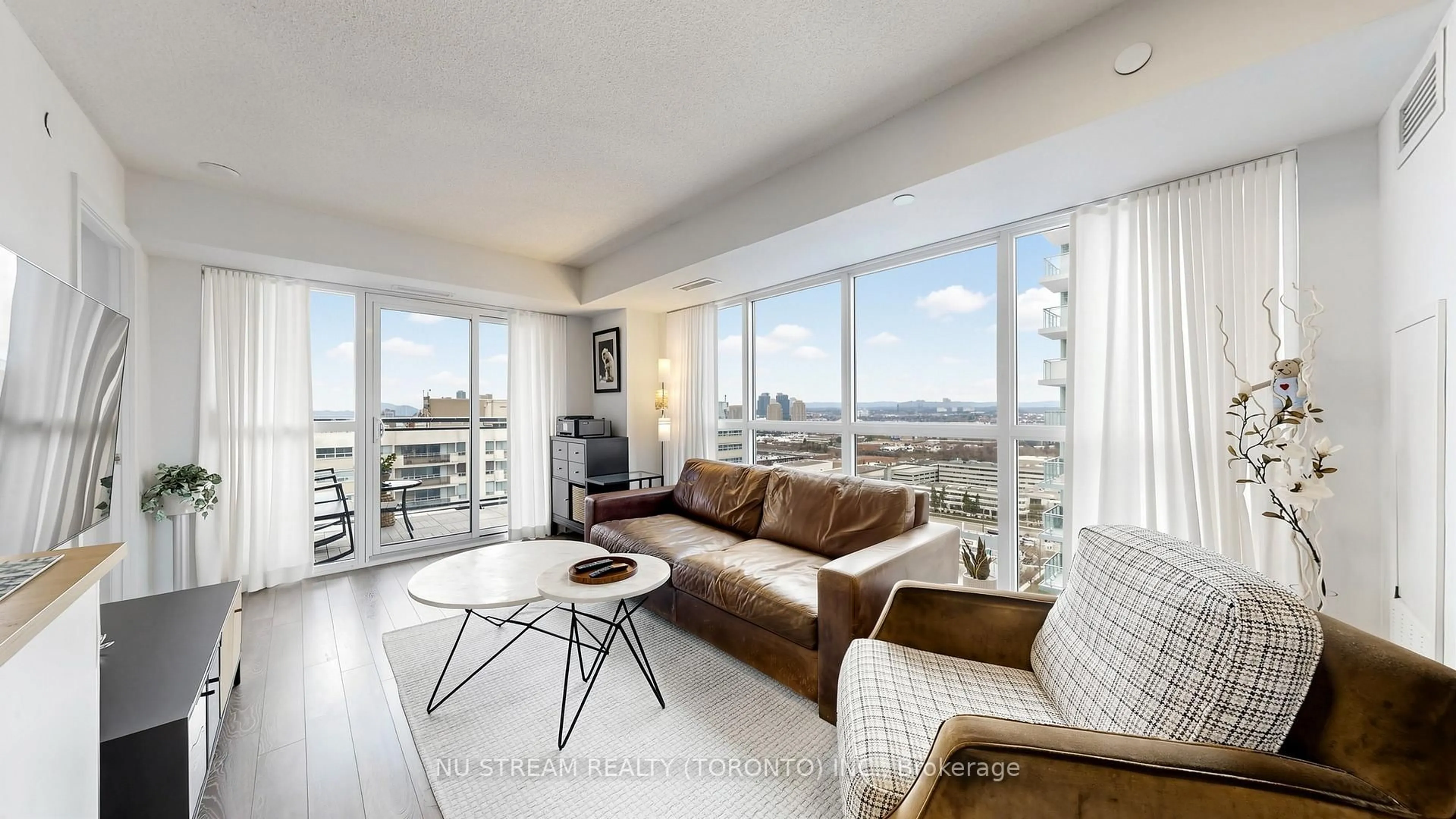 Living room with furniture, wood/laminate floor for 20 Meadowglen Pl #2109, Toronto Ontario M1G 0A9