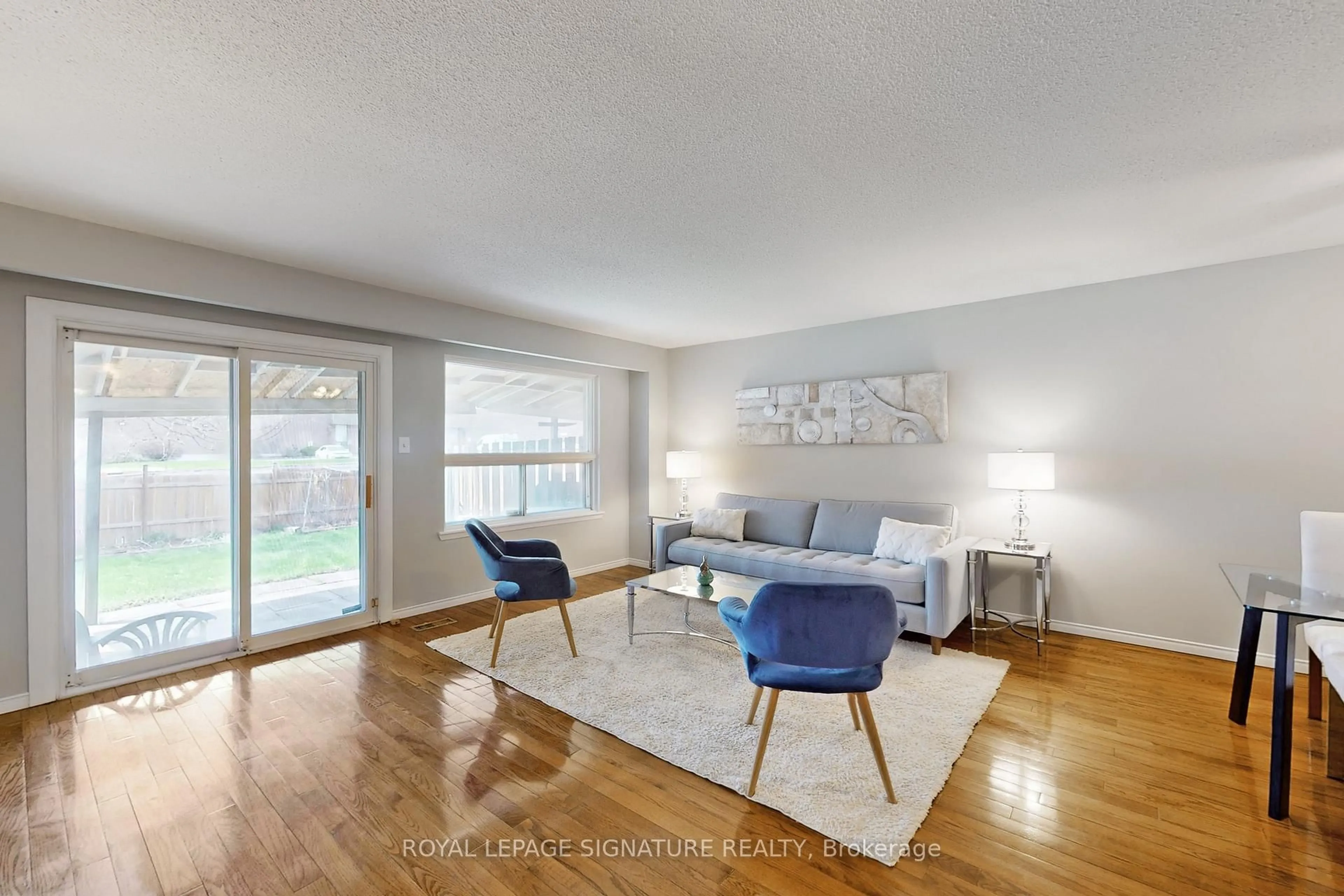 Living room with furniture, wood/laminate floor for 62 Valdor Dr, Toronto Ontario M1V 1R4