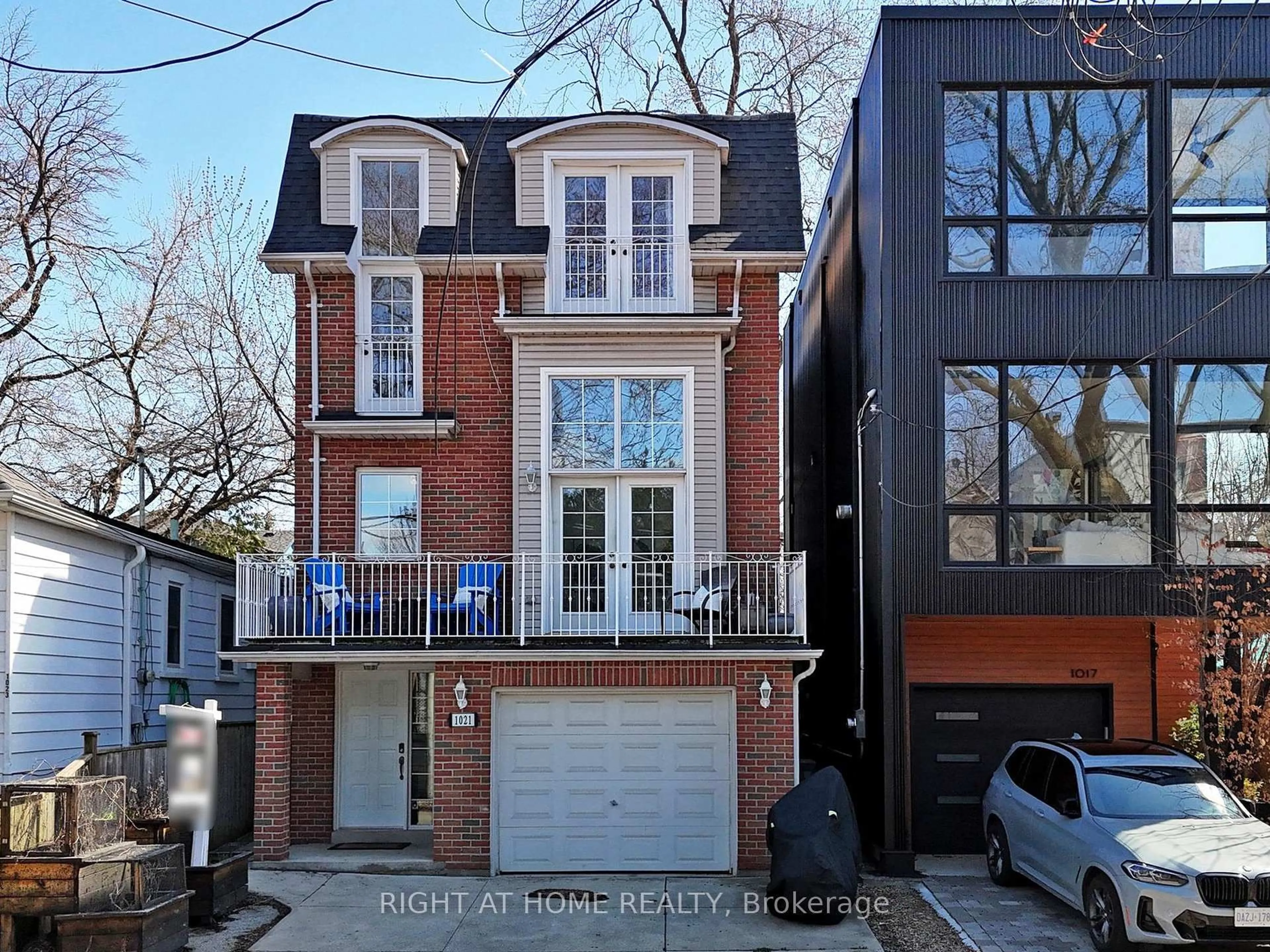 Home with brick exterior material, street for 1021 Craven Rd, Toronto Ontario M4J 4V7