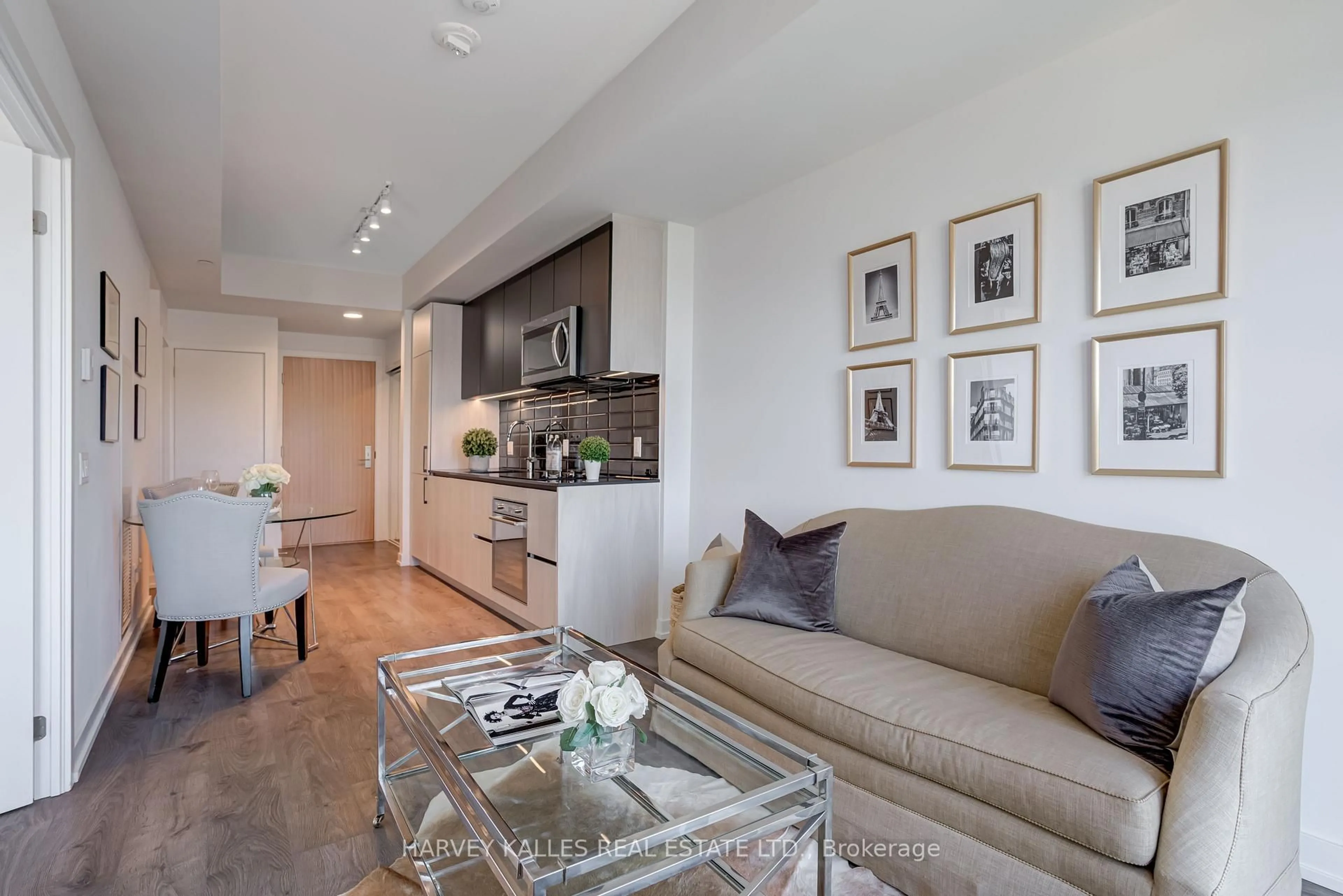 Living room with furniture, wood/laminate floor for 150 Logan Ave #541, Toronto Ontario M4M 0E4